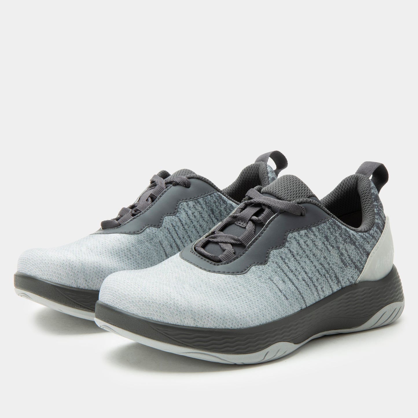 Gray and white sneakers on a light gray background