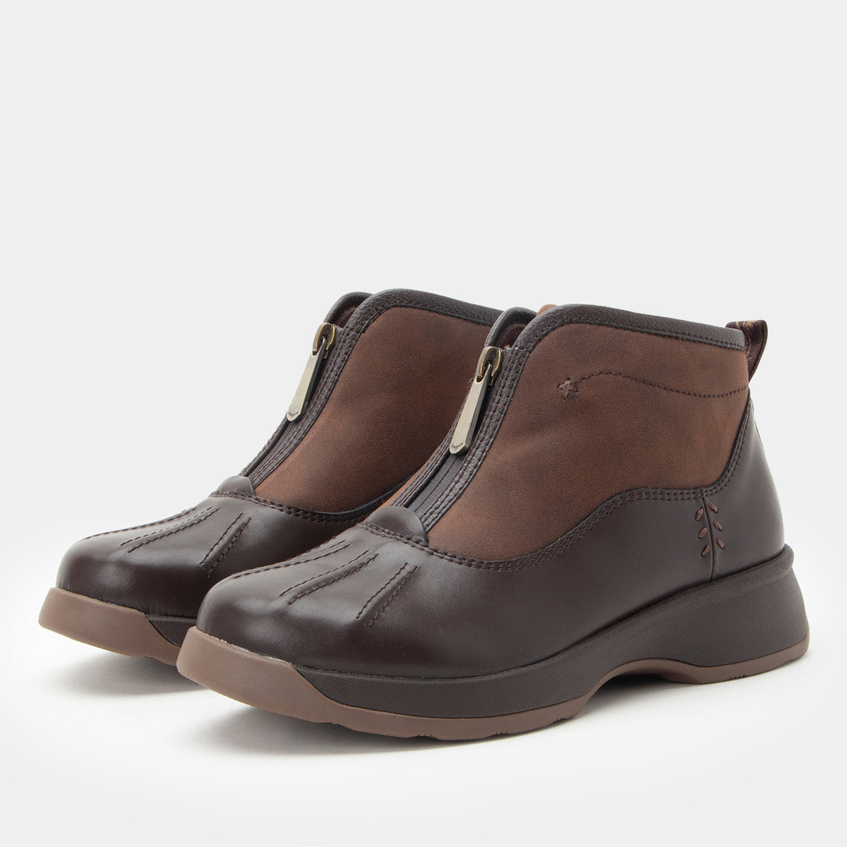 A pair of dark brown leather ankle boots with brown suede-like side panels and silver zipper pulls, shown on a light gray background.