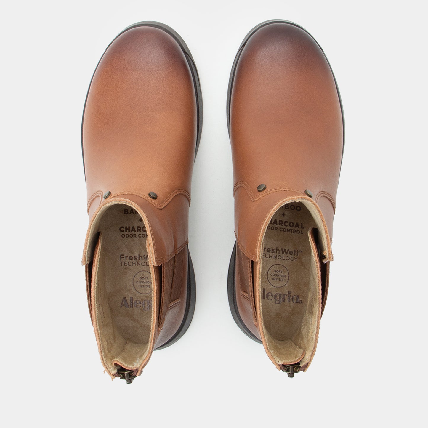 Pair of brown leather boots on a white background