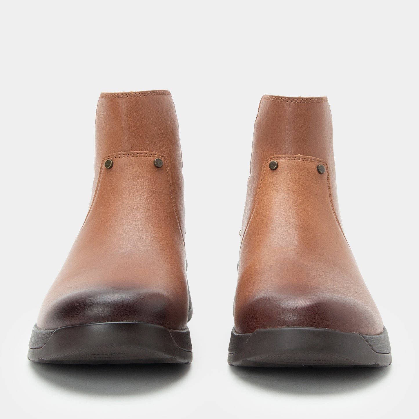 Pair of brown leather boots on a white background