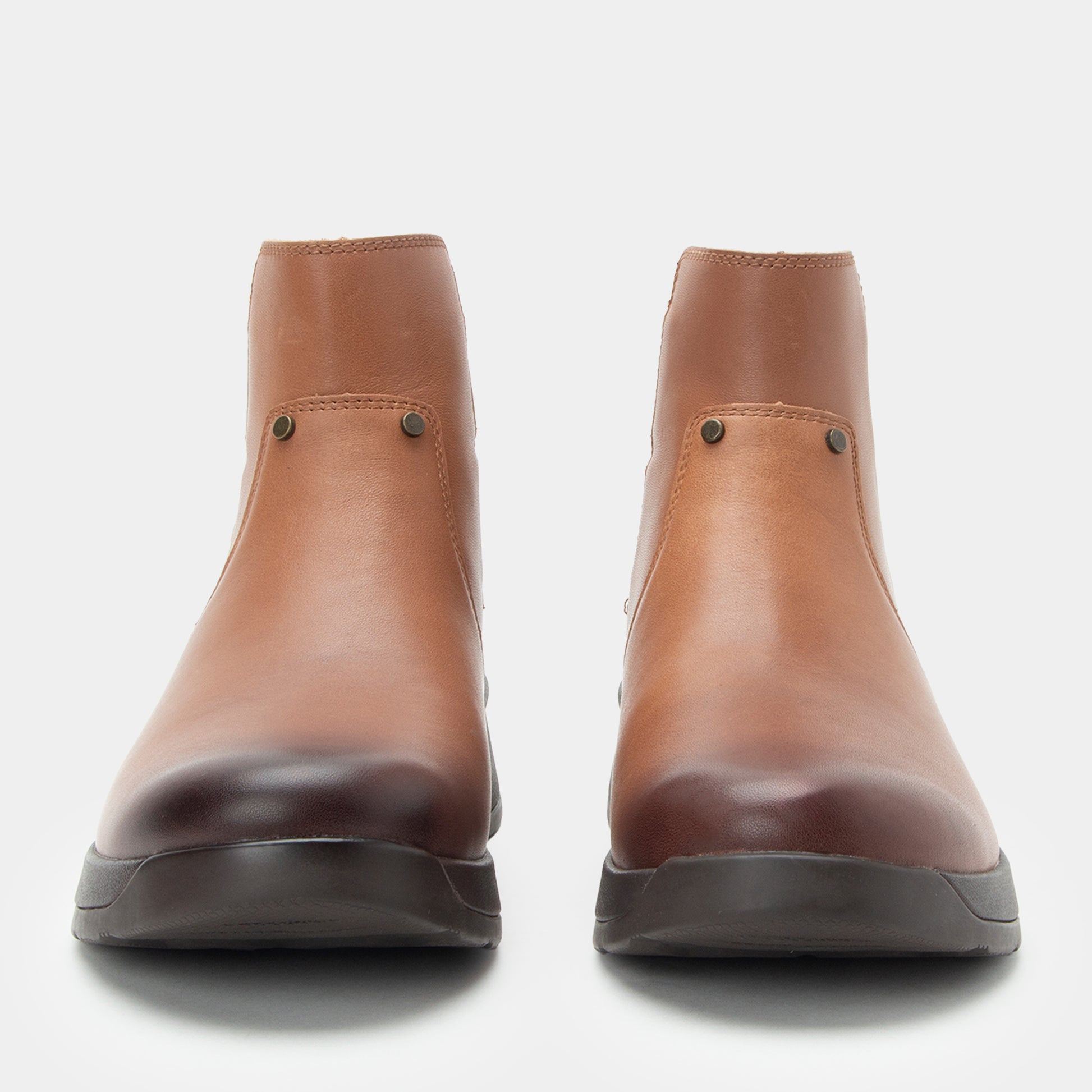 Pair of brown leather boots on a white background