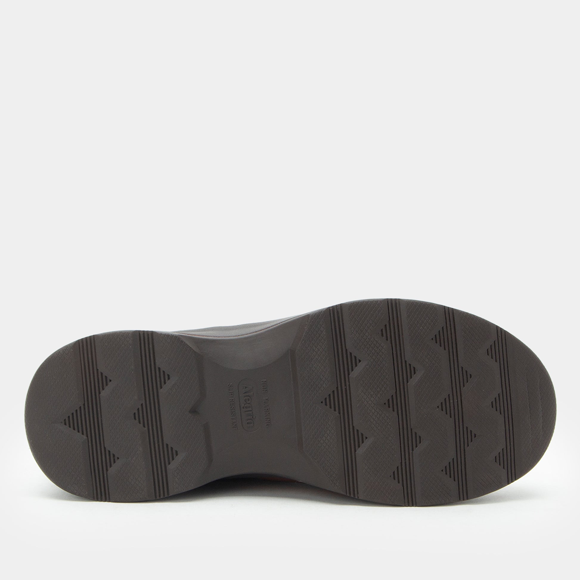Black shoe sole with tread pattern on a white background