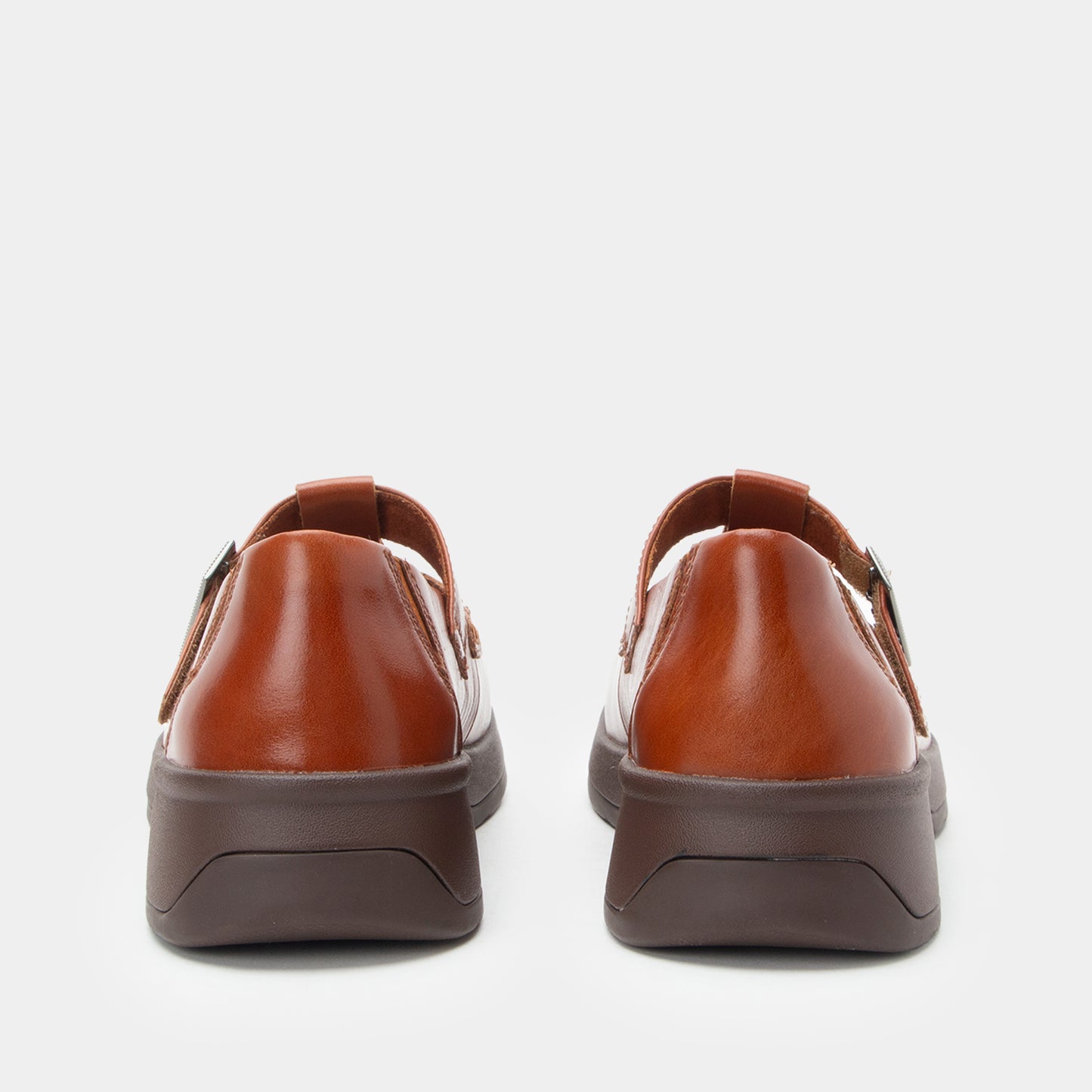 Pair of brown shoes on a white background
