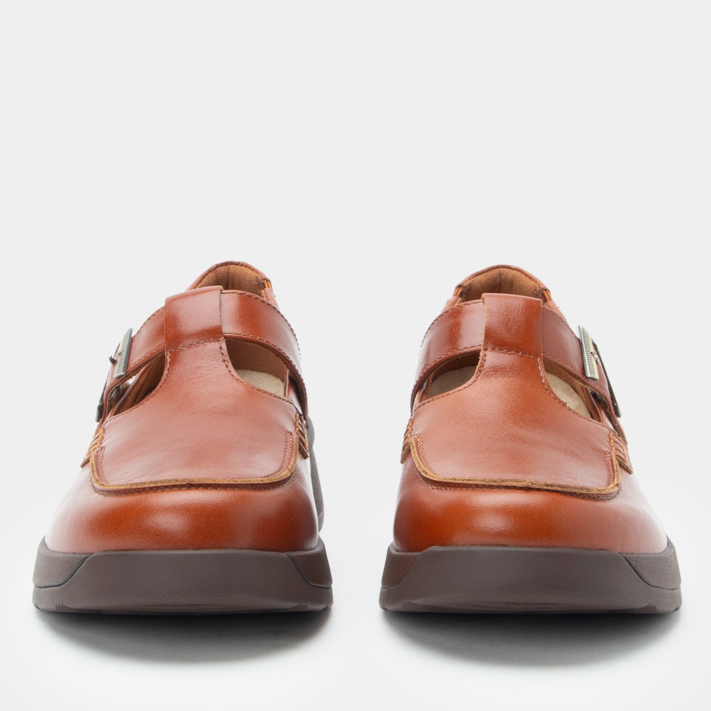 Pair of brown leather shoes on a white background