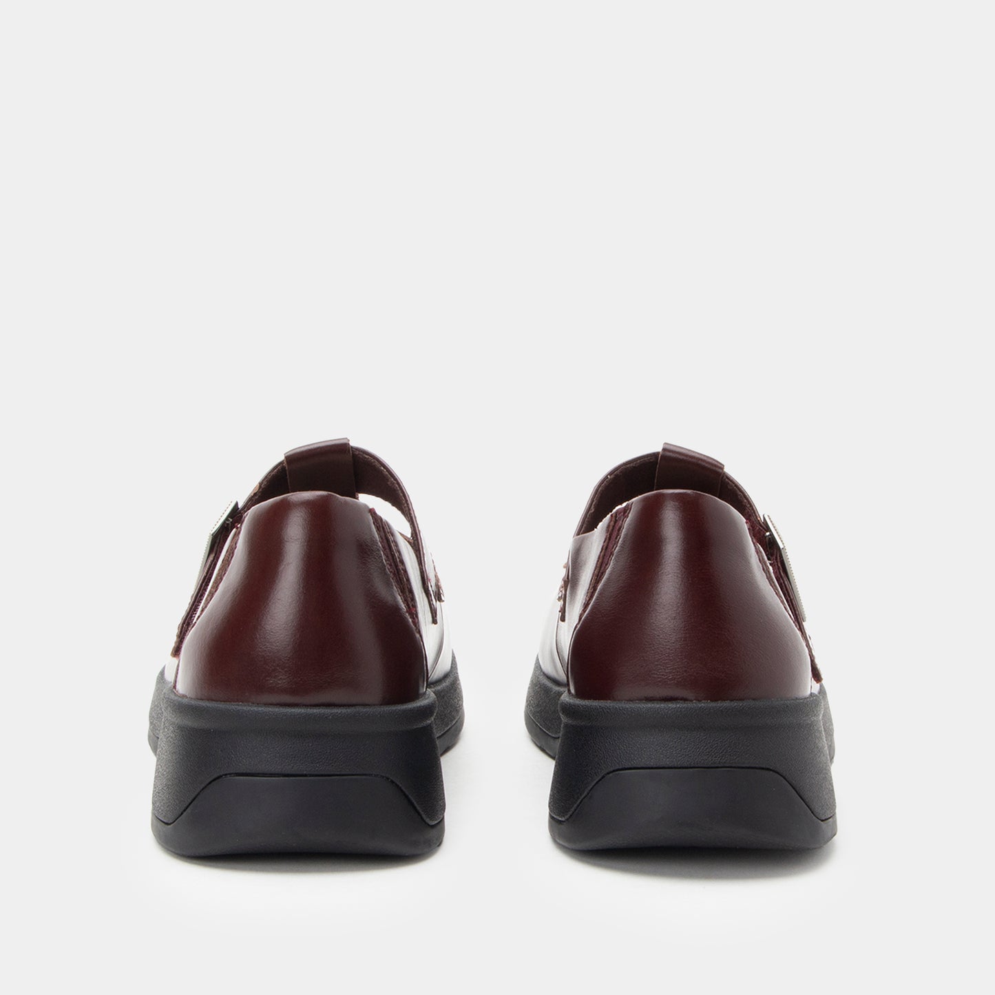 Pair of brown leather shoes on a white background