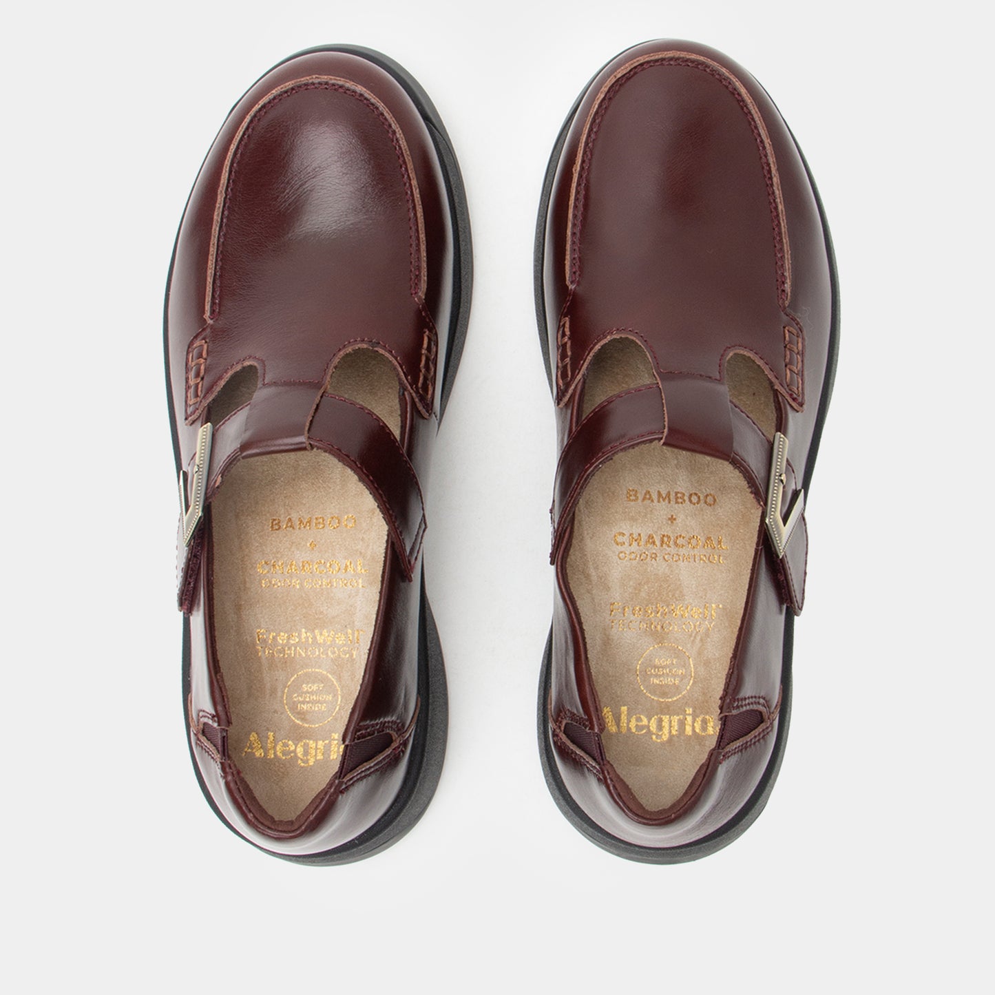 Brown shoes with visible brand name on a white background