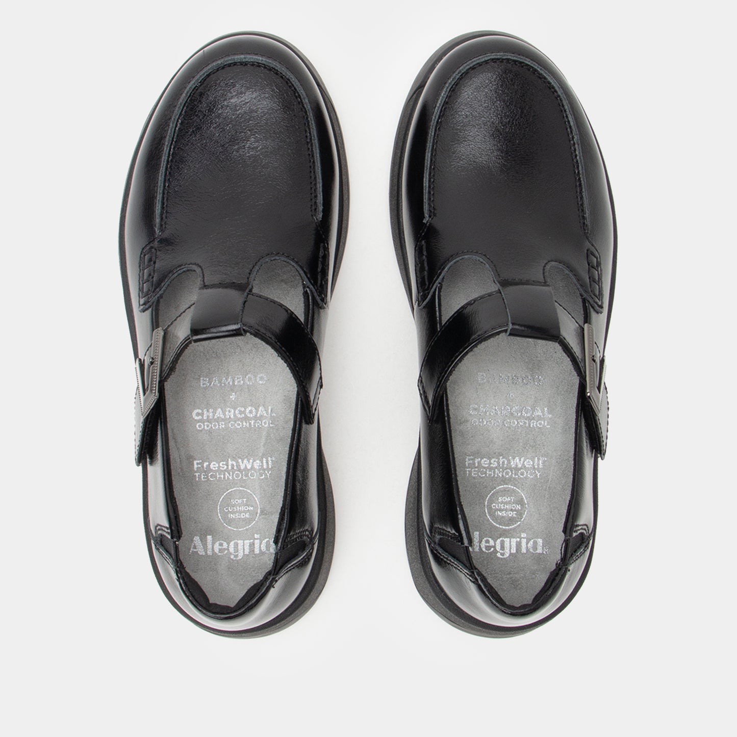 Black leather shoes with 'Alegria' branding on a white background
