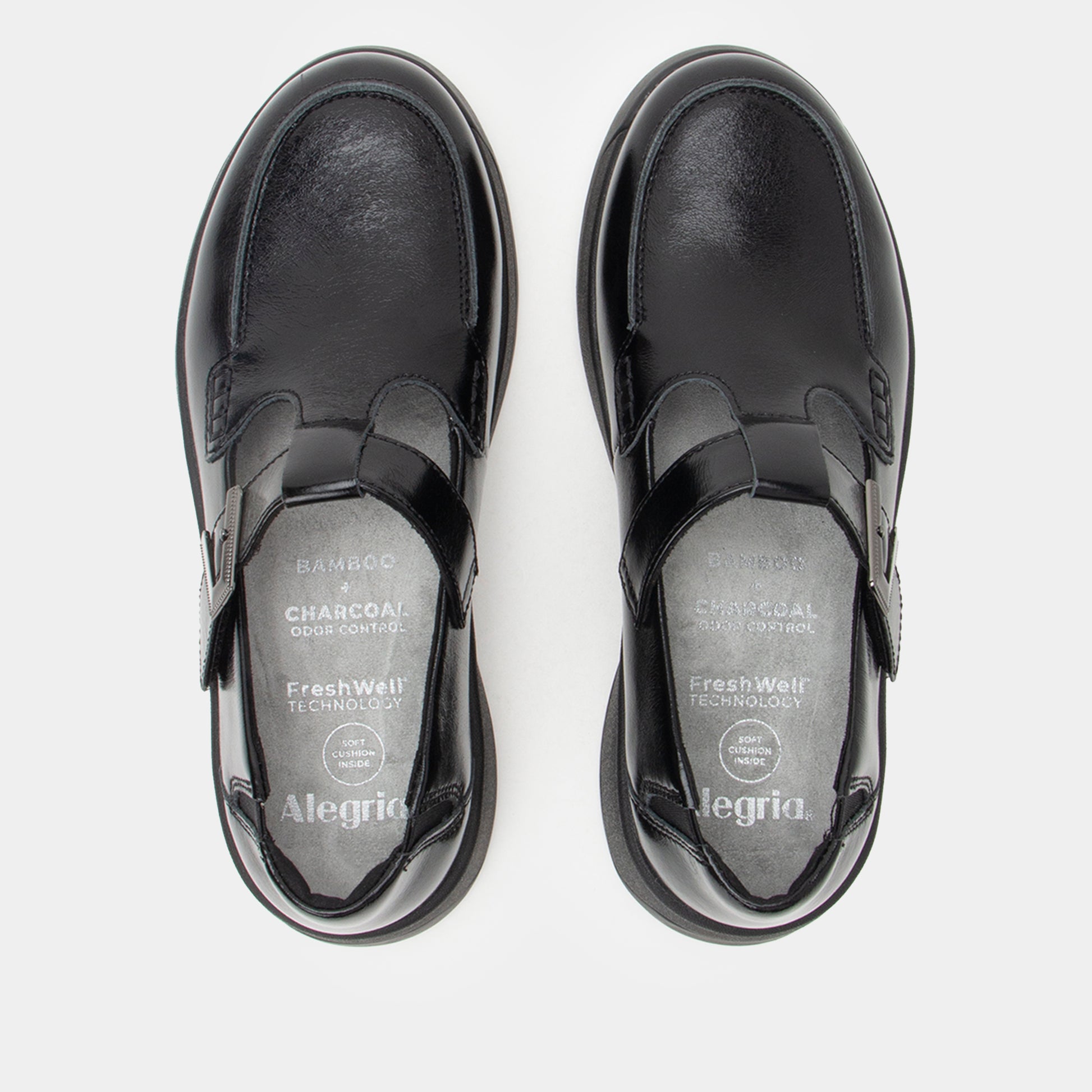 Black leather shoes with 'Alegria' branding on a white background