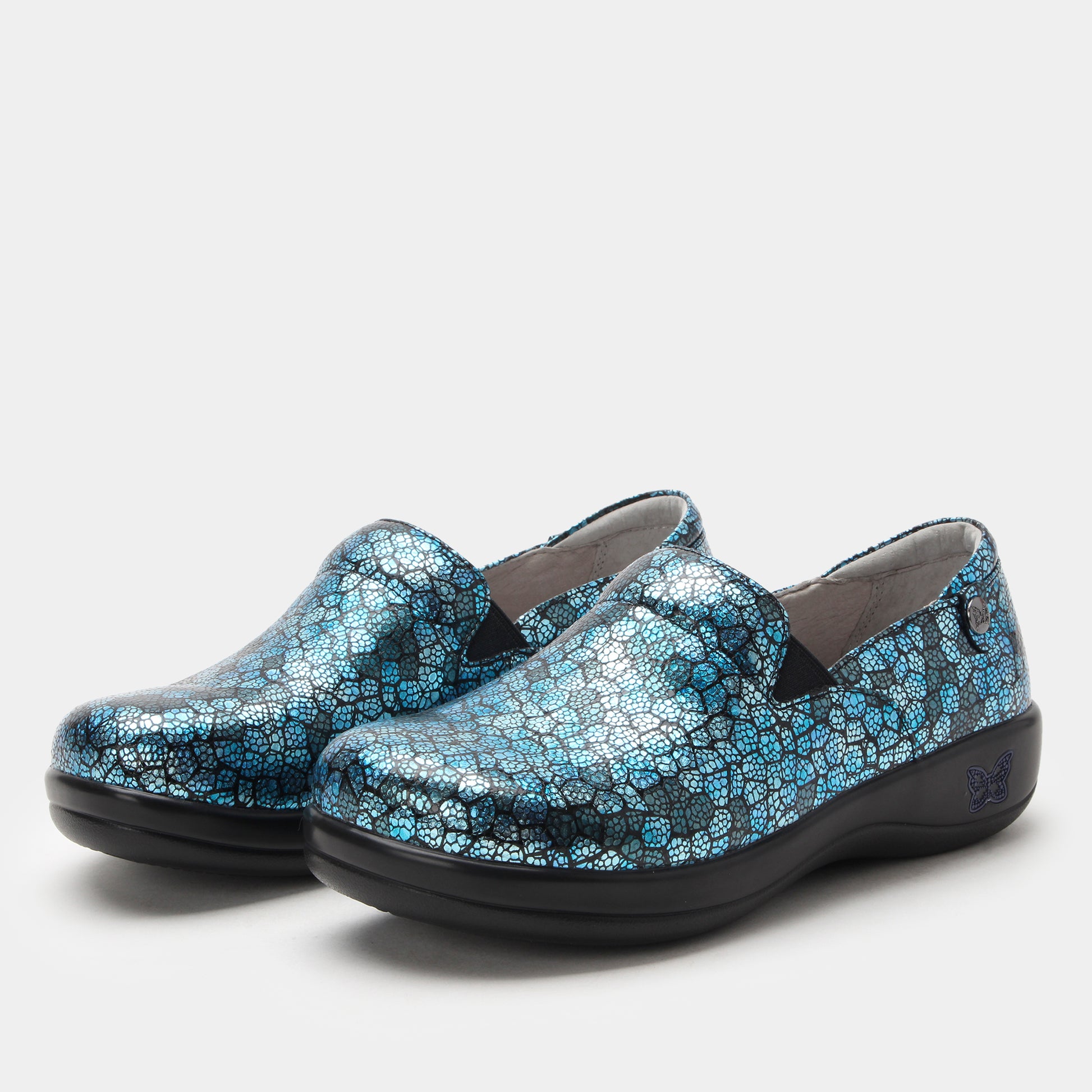 Pair of blue patterned shoes on a white background