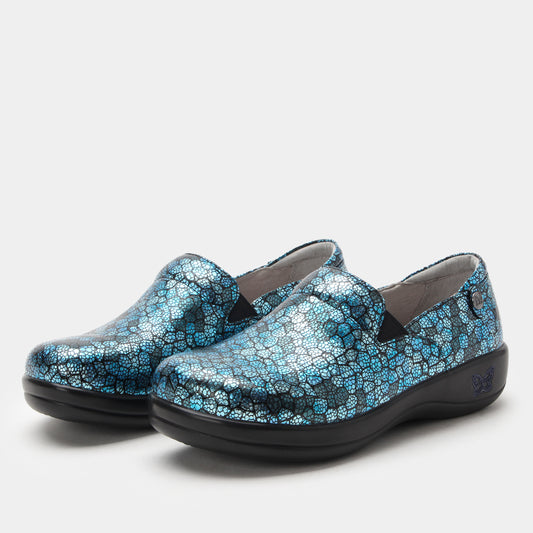Pair of blue patterned shoes on a white background