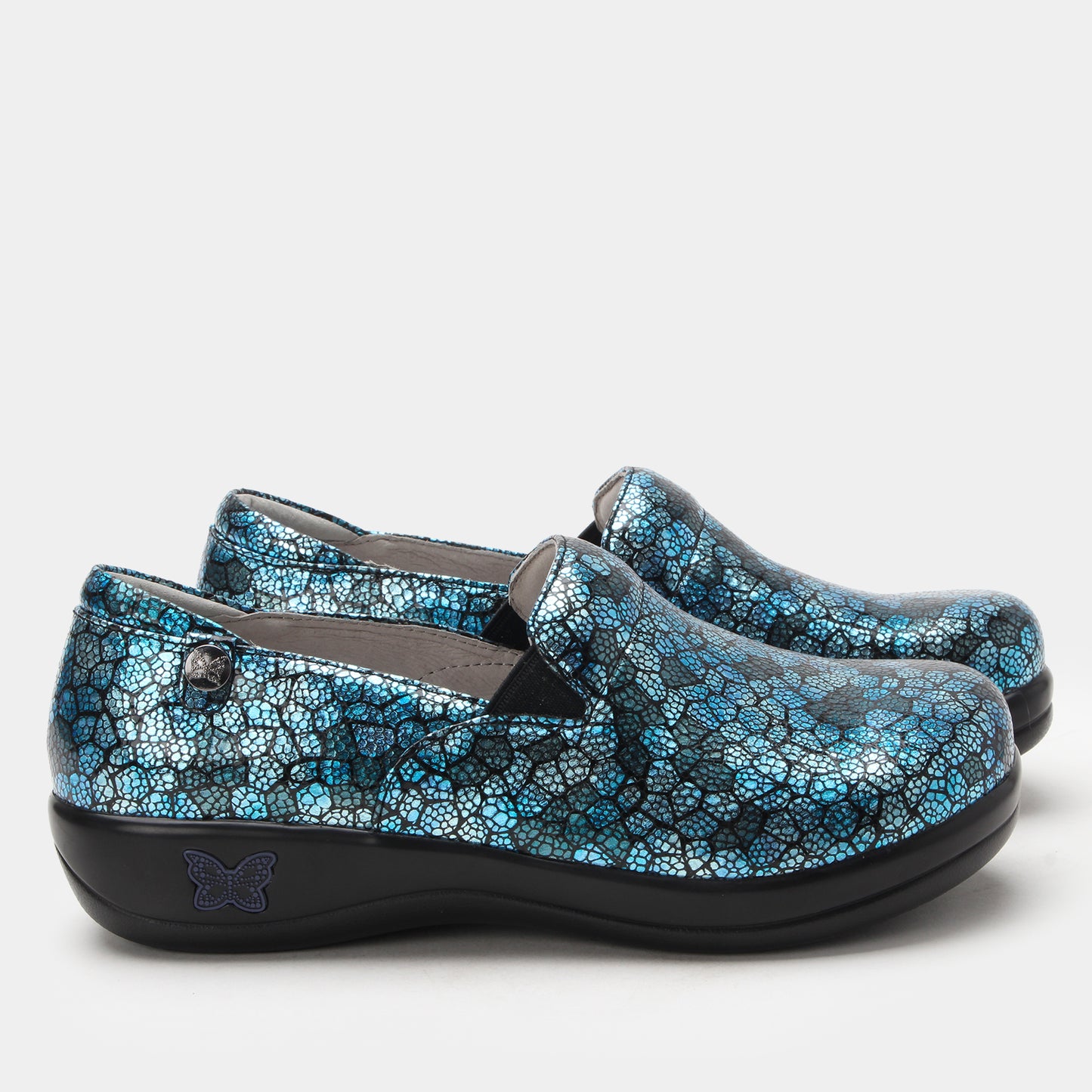 Pair of blue patterned shoes on a white background