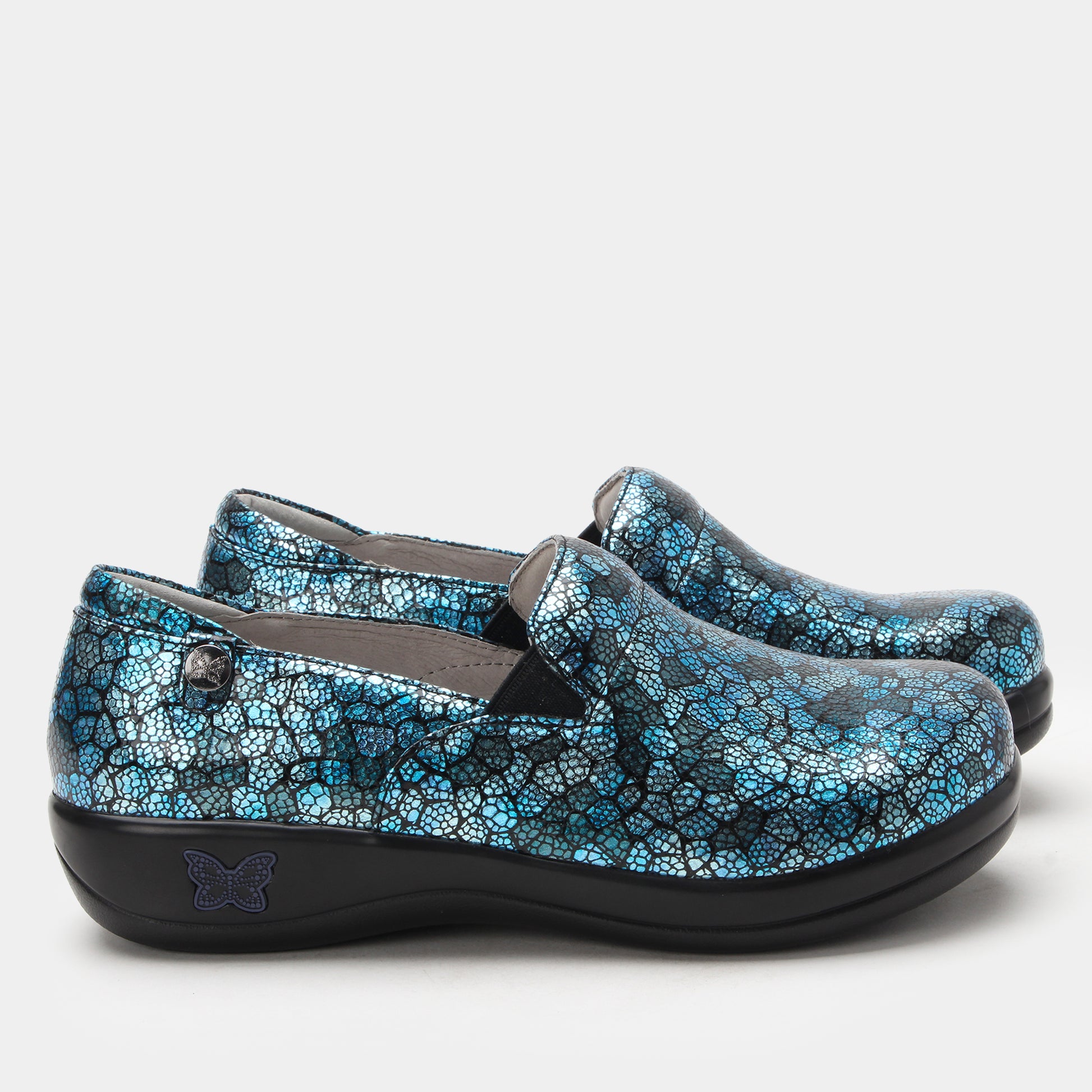 Pair of blue patterned shoes on a white background