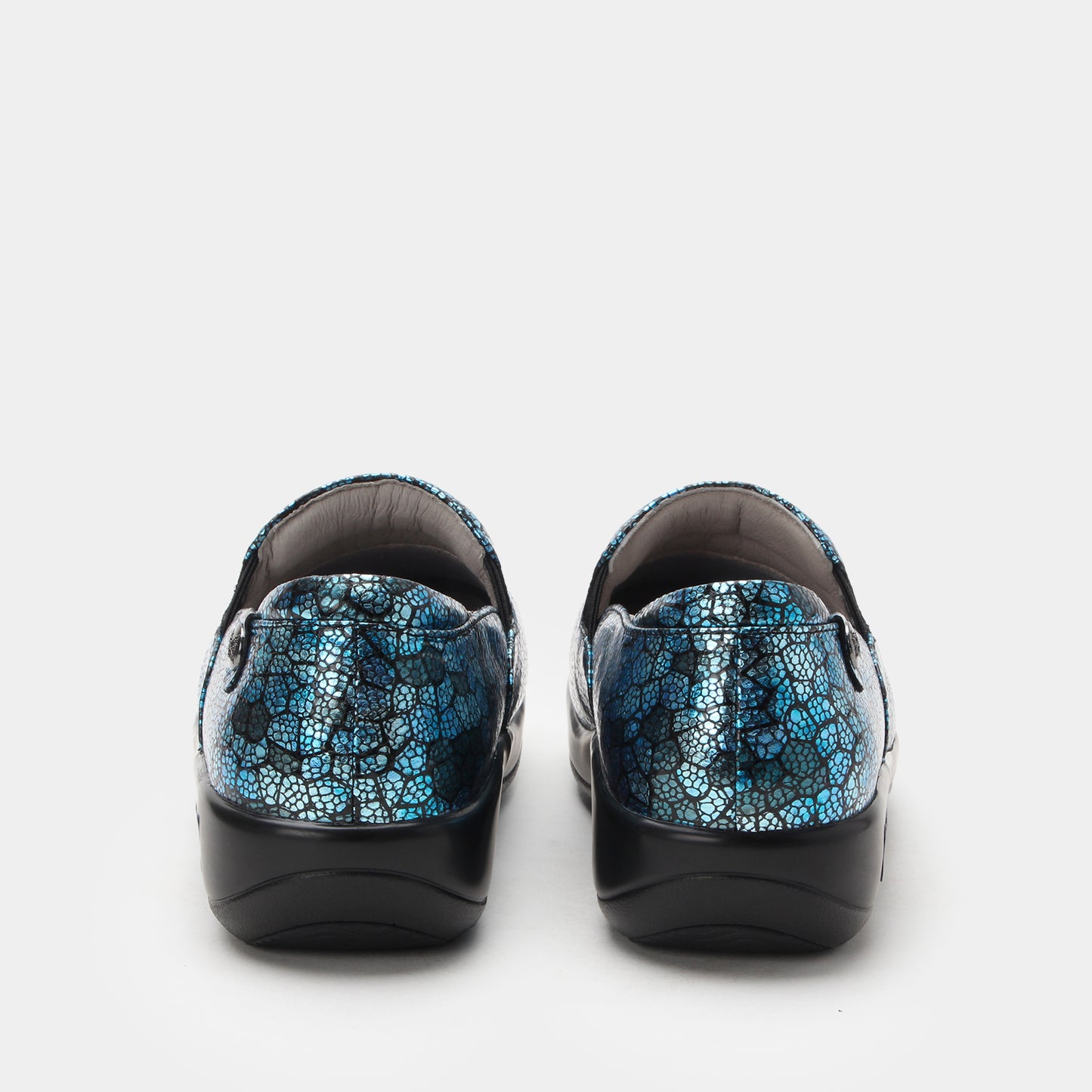 Pair of black shoes with blue patterned soles on a white background