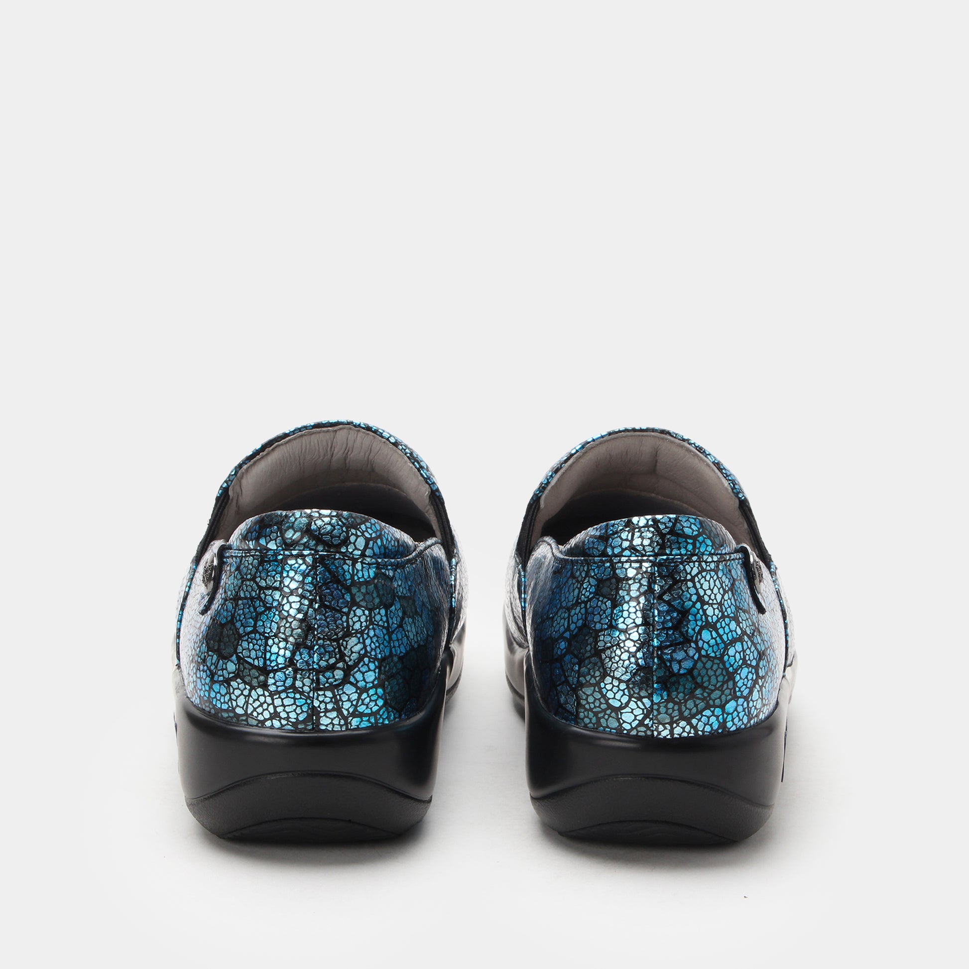 Pair of black shoes with blue patterned soles on a white background