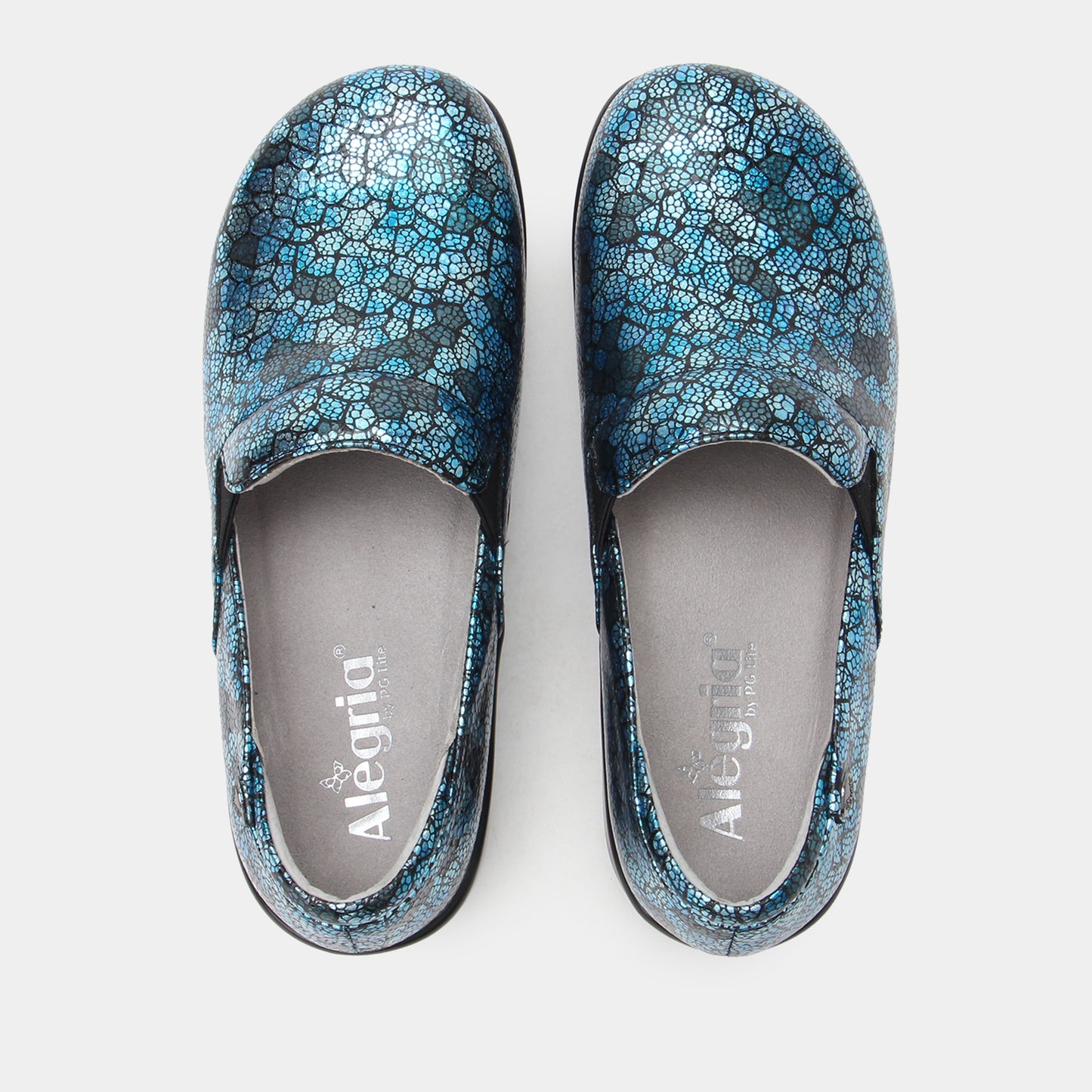 Pair of blue floral-patterned shoes on a white background