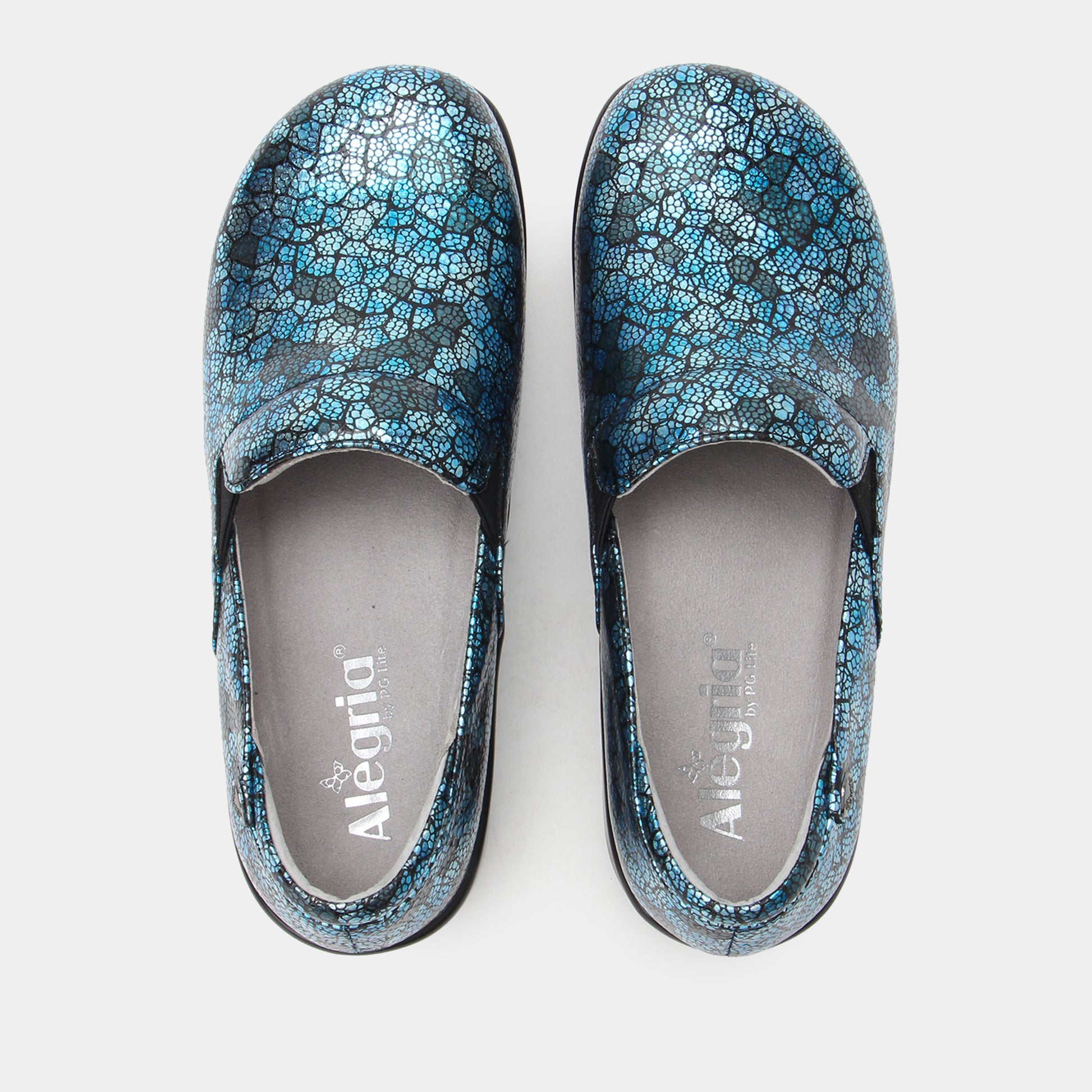 Pair of blue floral-patterned shoes on a white background