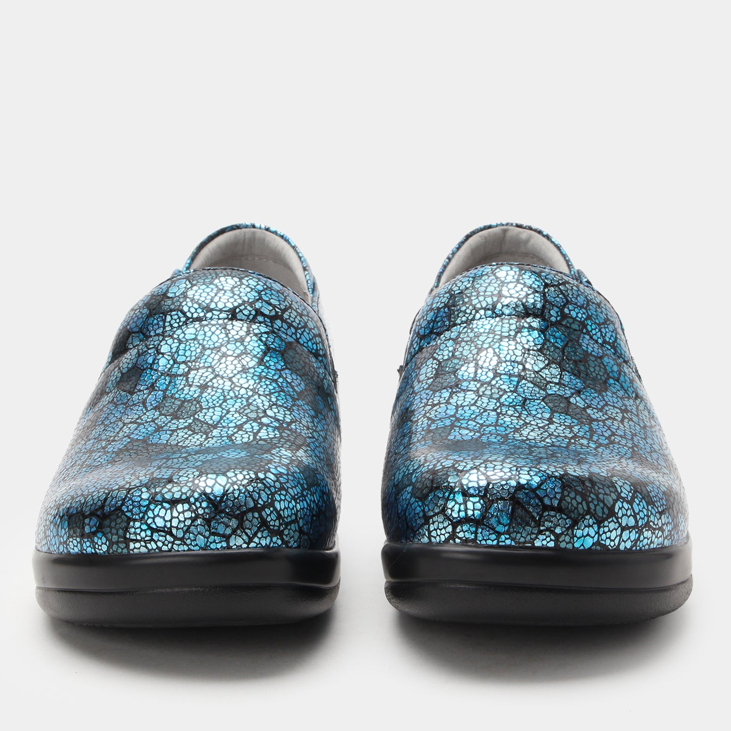 Pair of blue patterned shoes on a white background