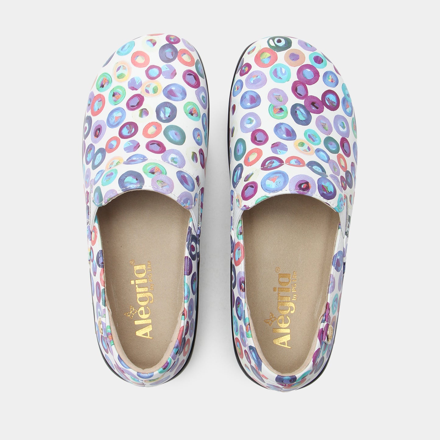 Pair of colorful patterned shoes with 'Alegria' branding on a light background