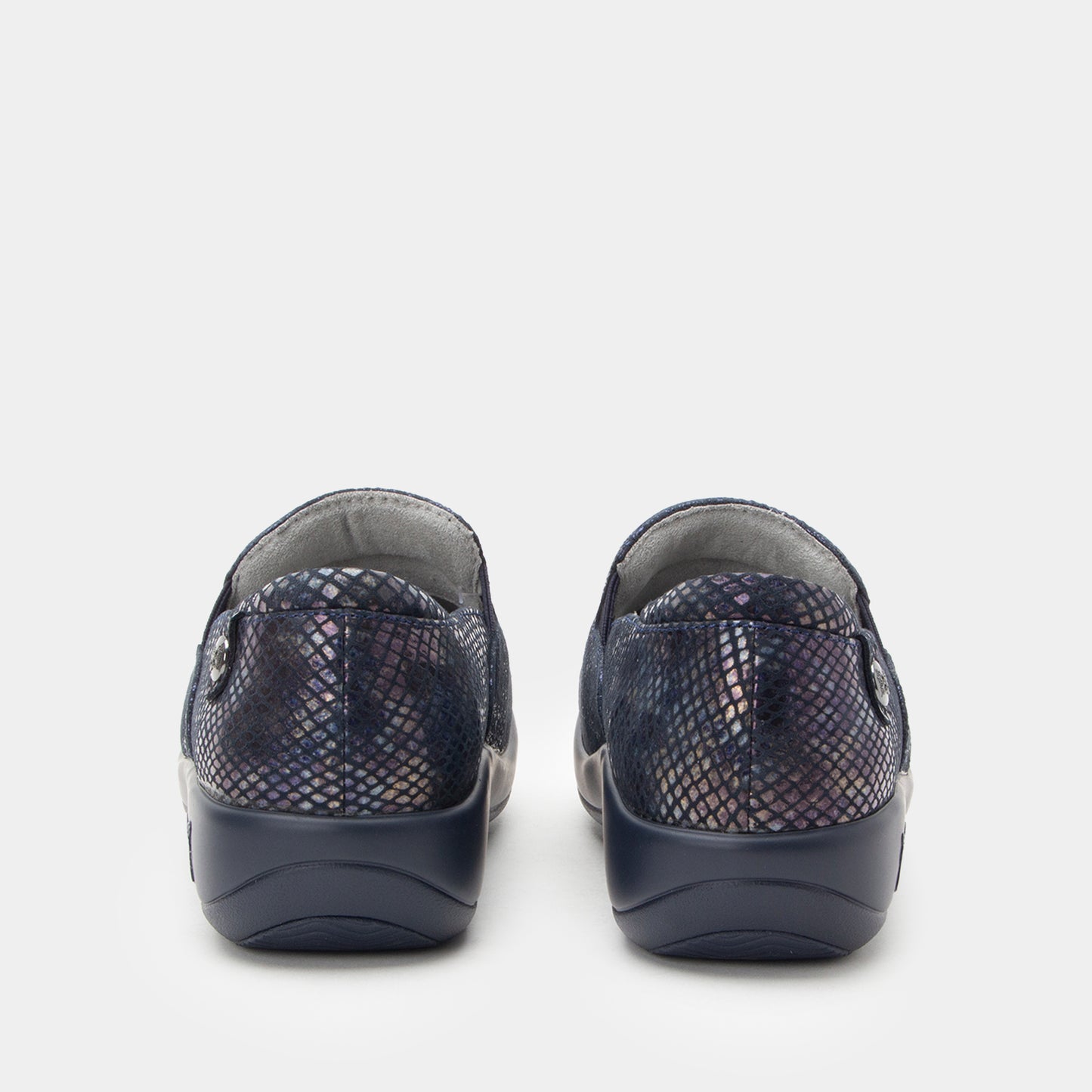 Pair of navy slip-on shoes with patterned design on a white background