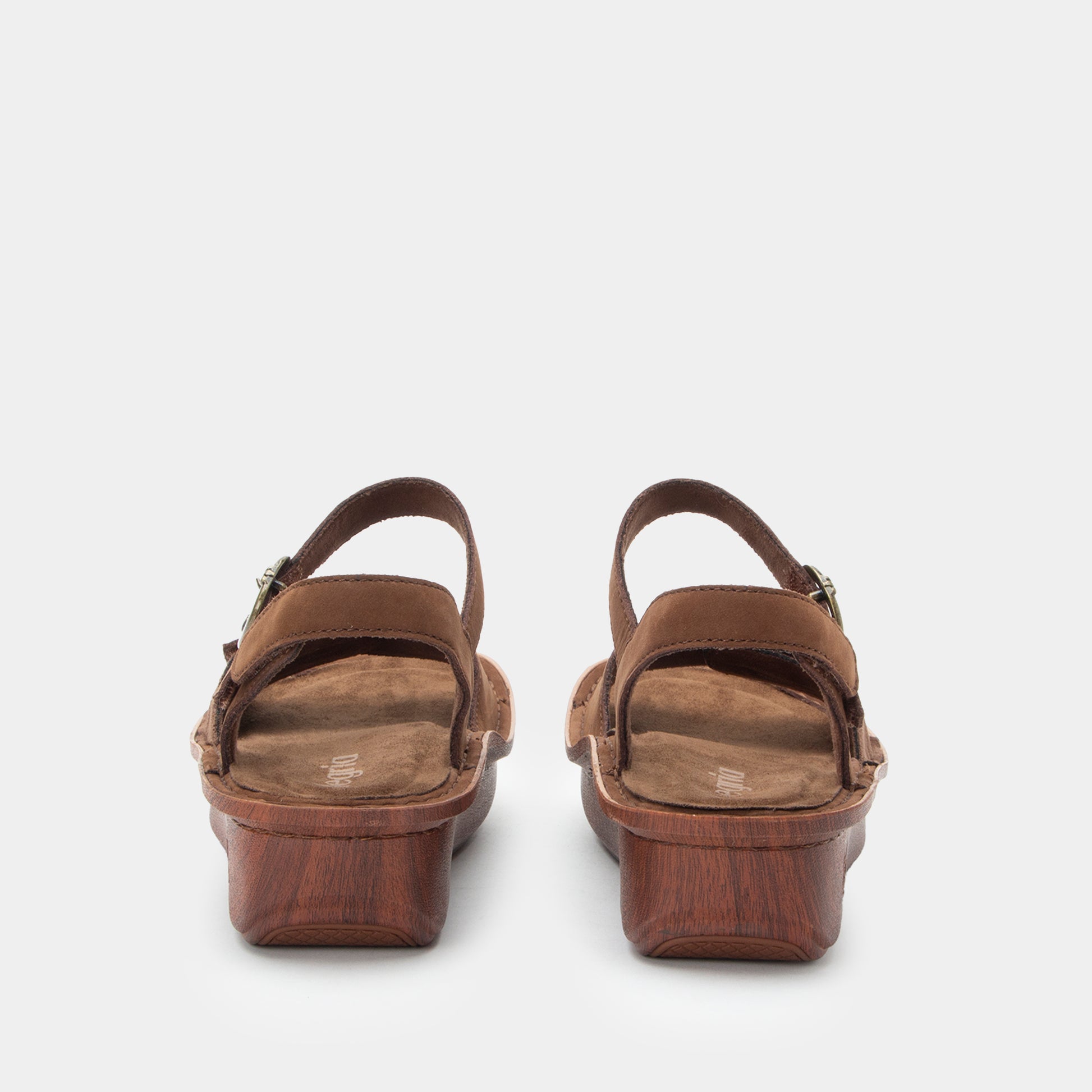 Pair of brown sandals on a white background