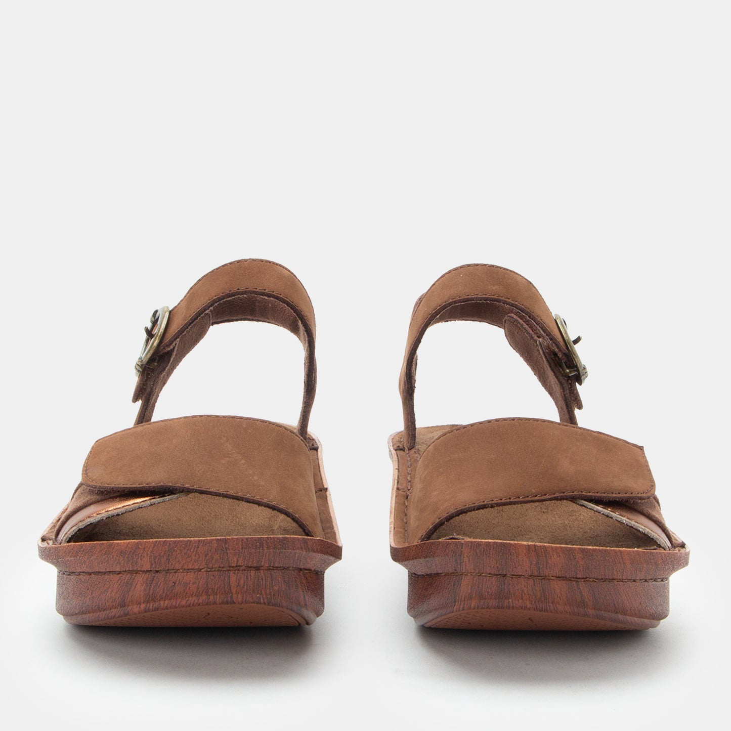 Pair of brown sandals on a white background