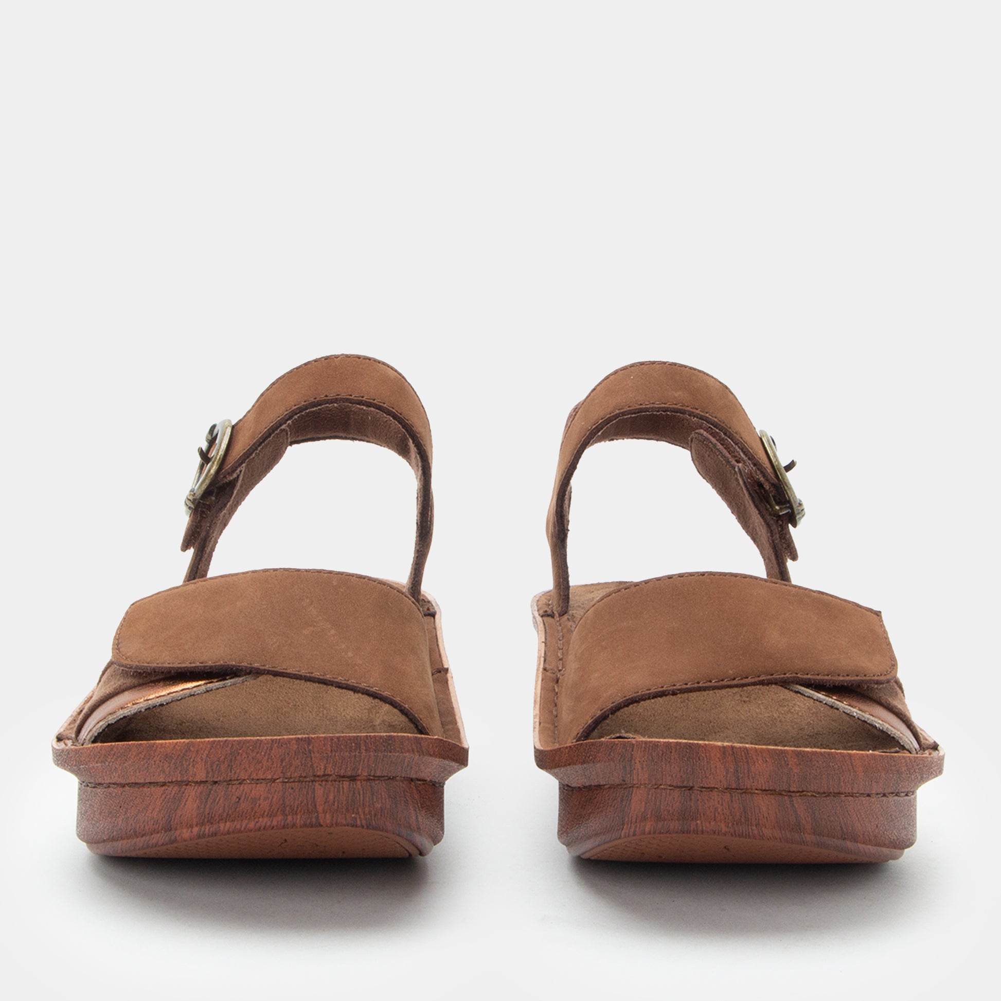 Pair of brown sandals on a white background