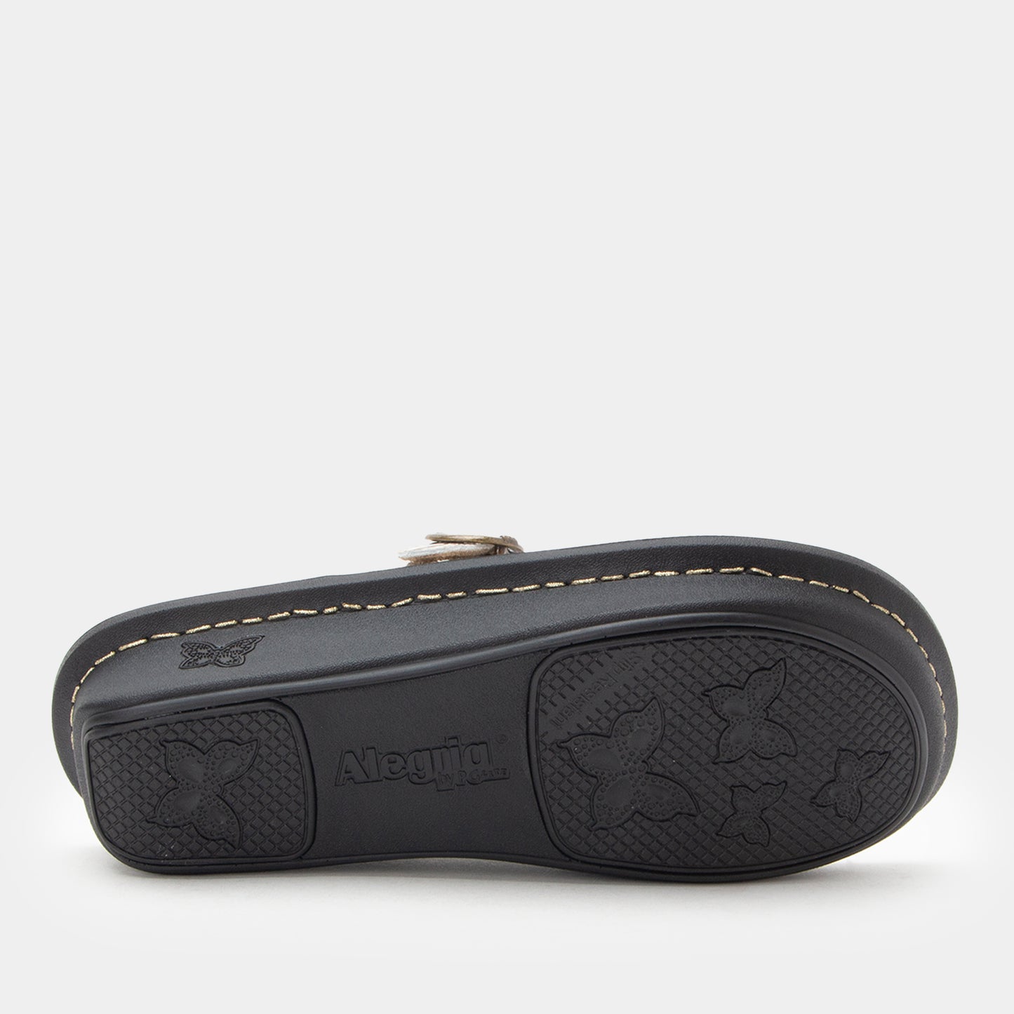 Black sandal with star pattern on sole on a white background