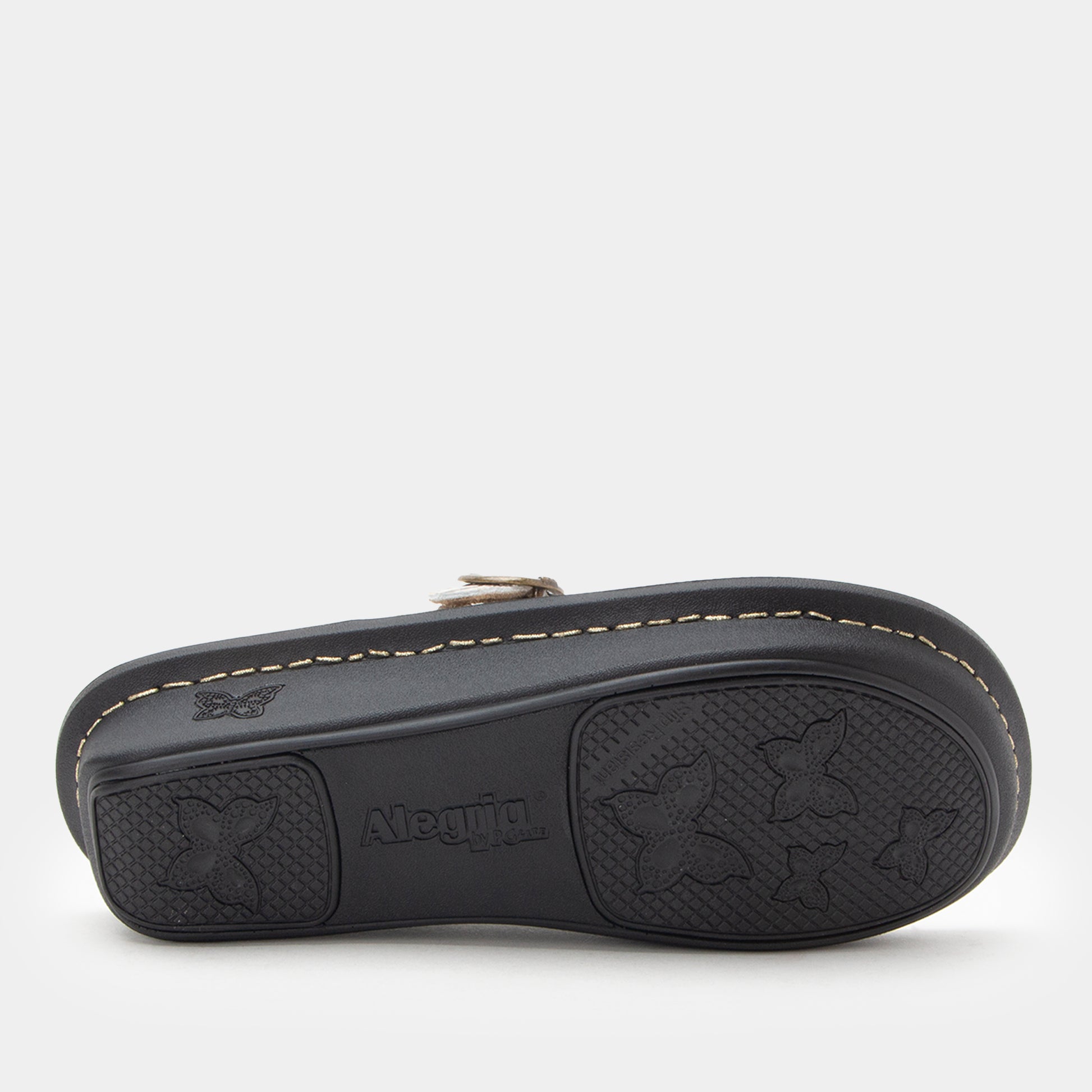 Black sandal with star pattern on sole on a white background