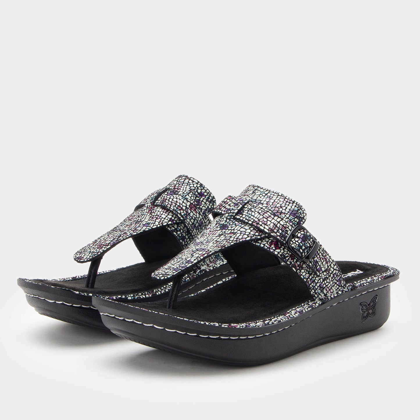 Black and silver sandal on a white background