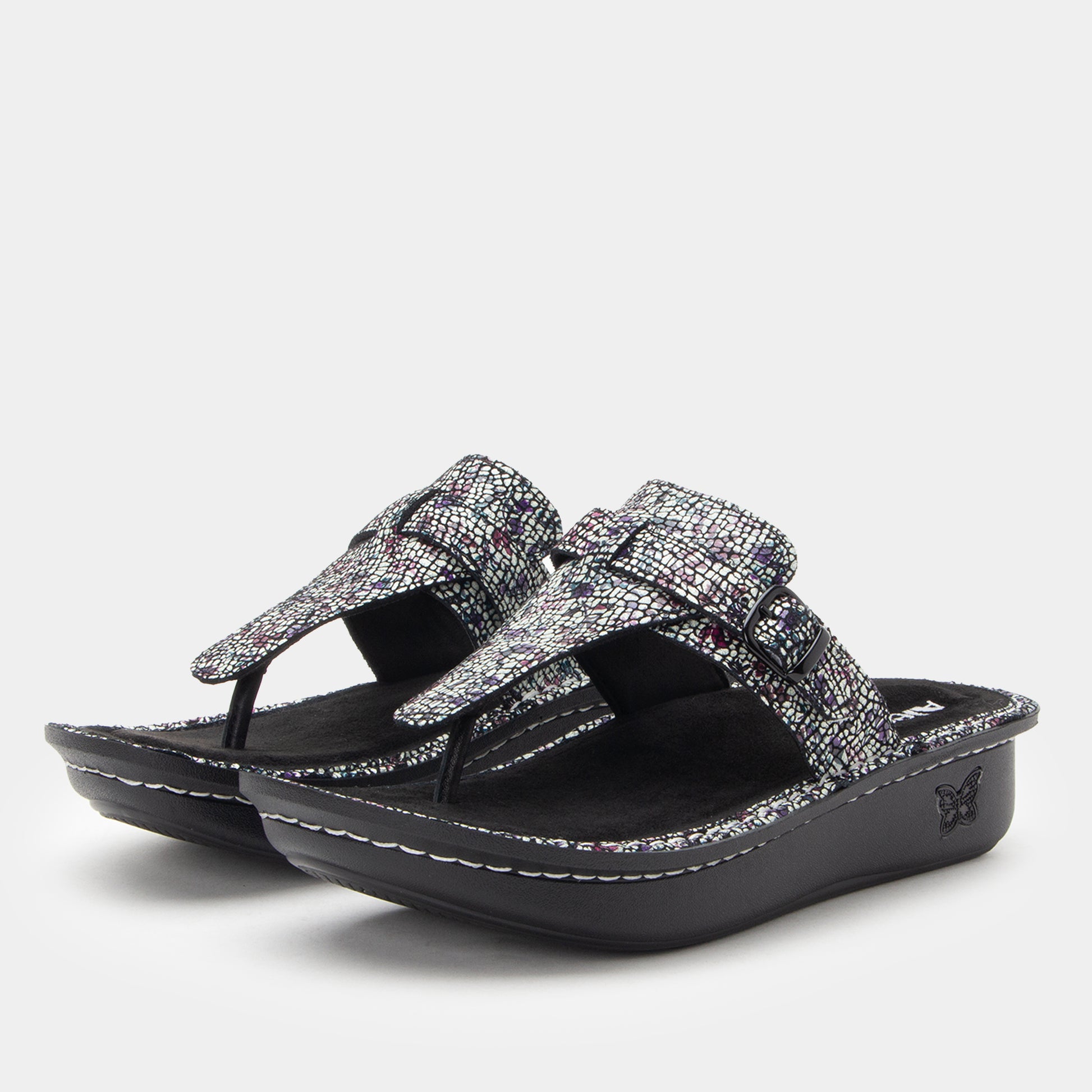 Black and silver sandal on a white background