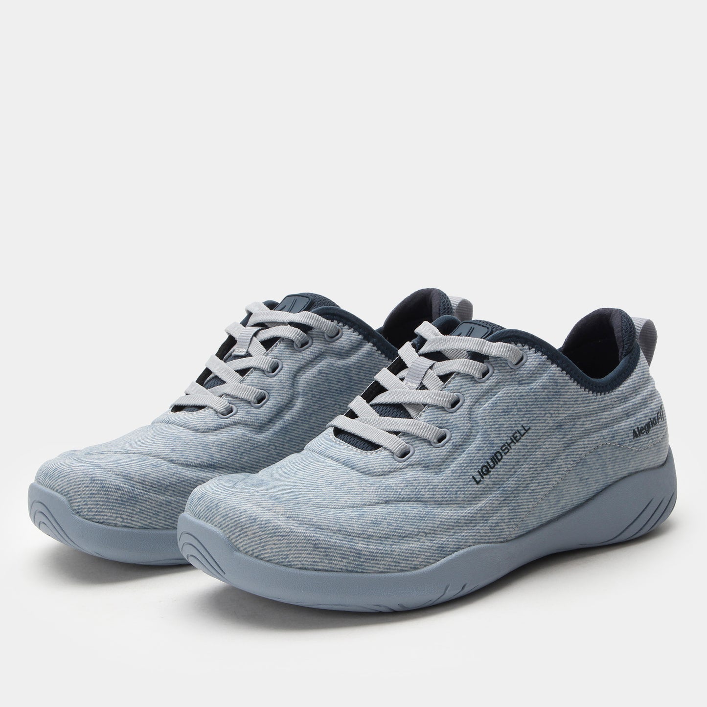 Pair of gray sneakers with black accents on a white background