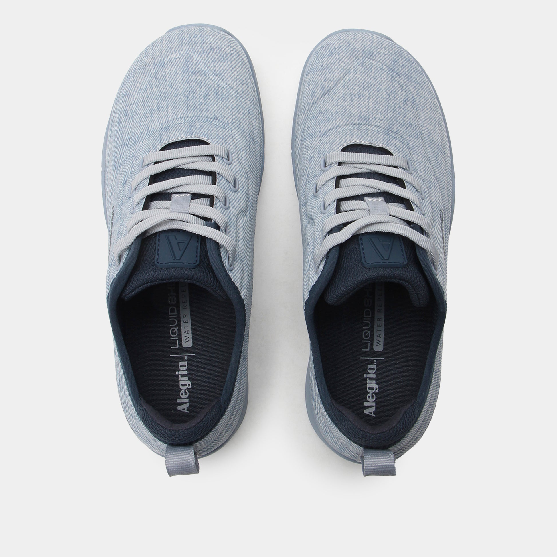 Pair of gray sneakers with visible brand name on a white background