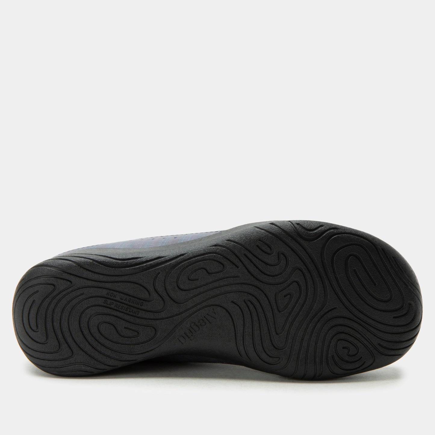 Black shoe sole with wavy tread pattern on a white background