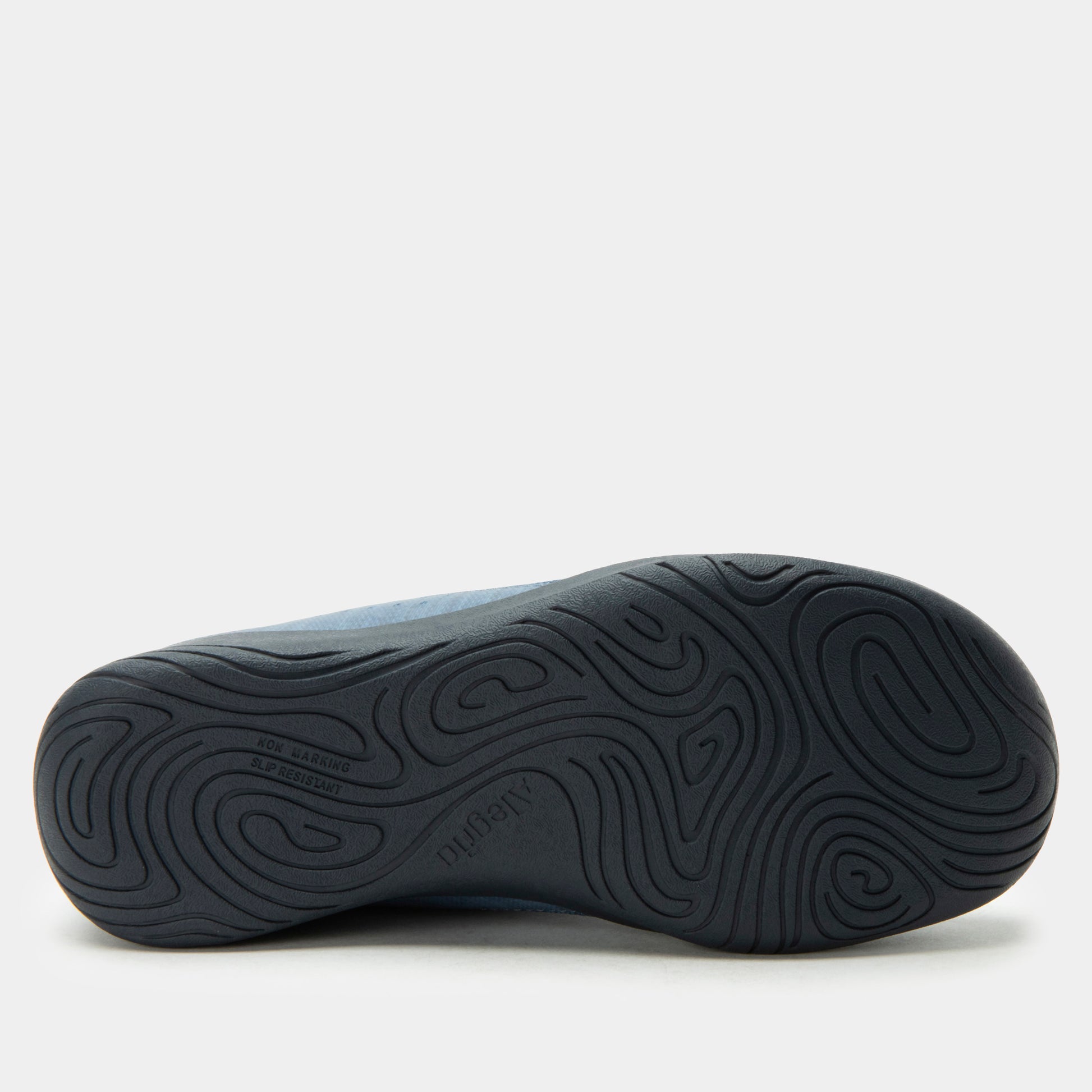 Black shoe sole with wavy pattern on a white background