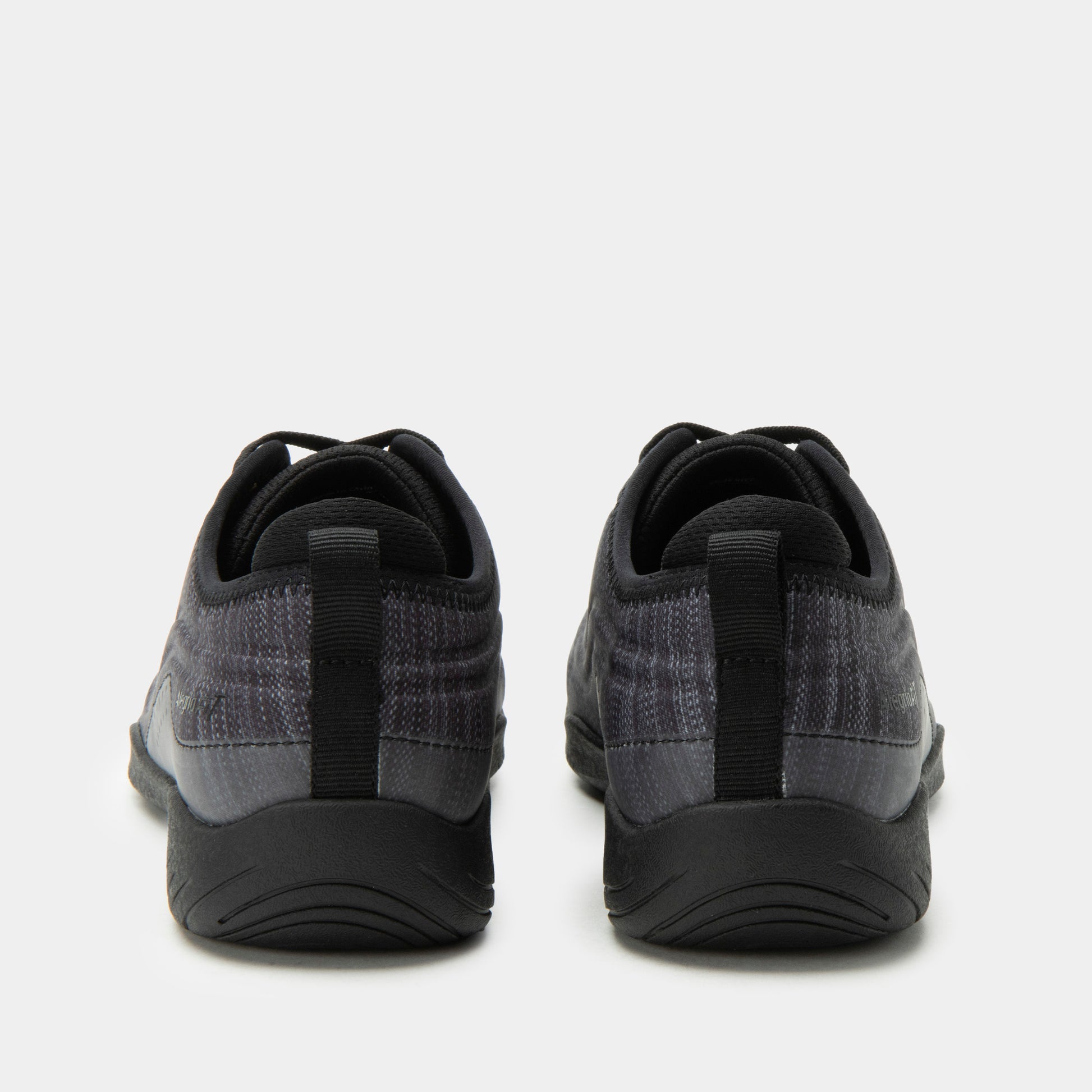 Black and gray athletic shoes on a white background