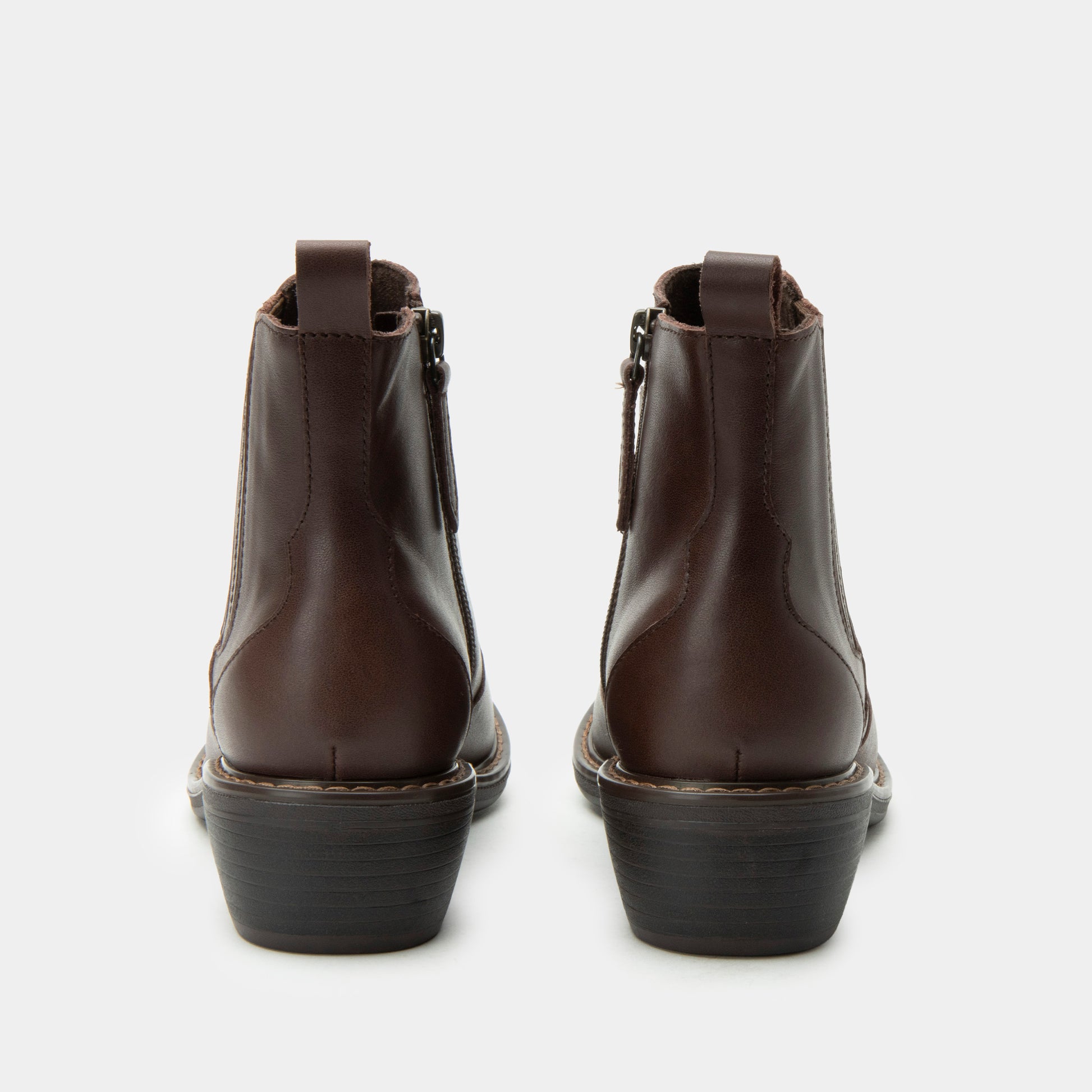 Pair of brown leather boots on a white background