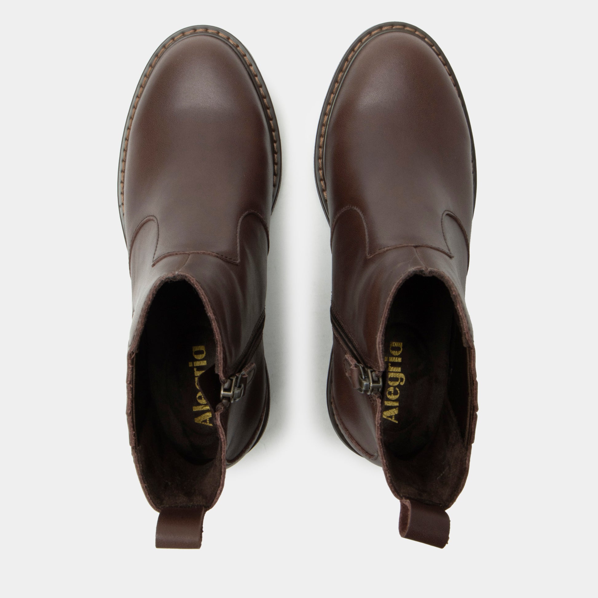 Pair of brown ankle boots on a white background