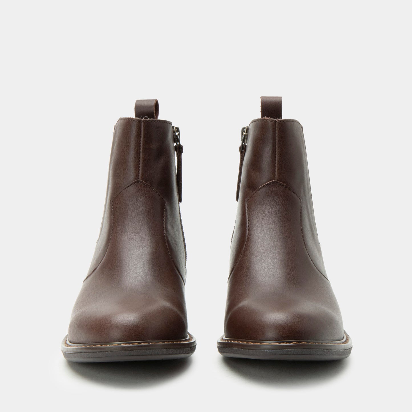 Pair of brown leather boots on a white background