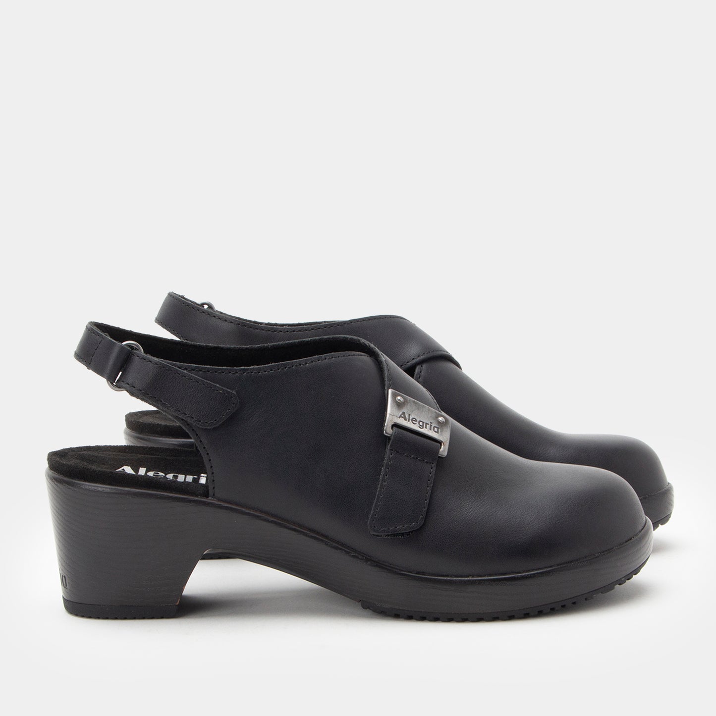 Black clogs with strap on a white background