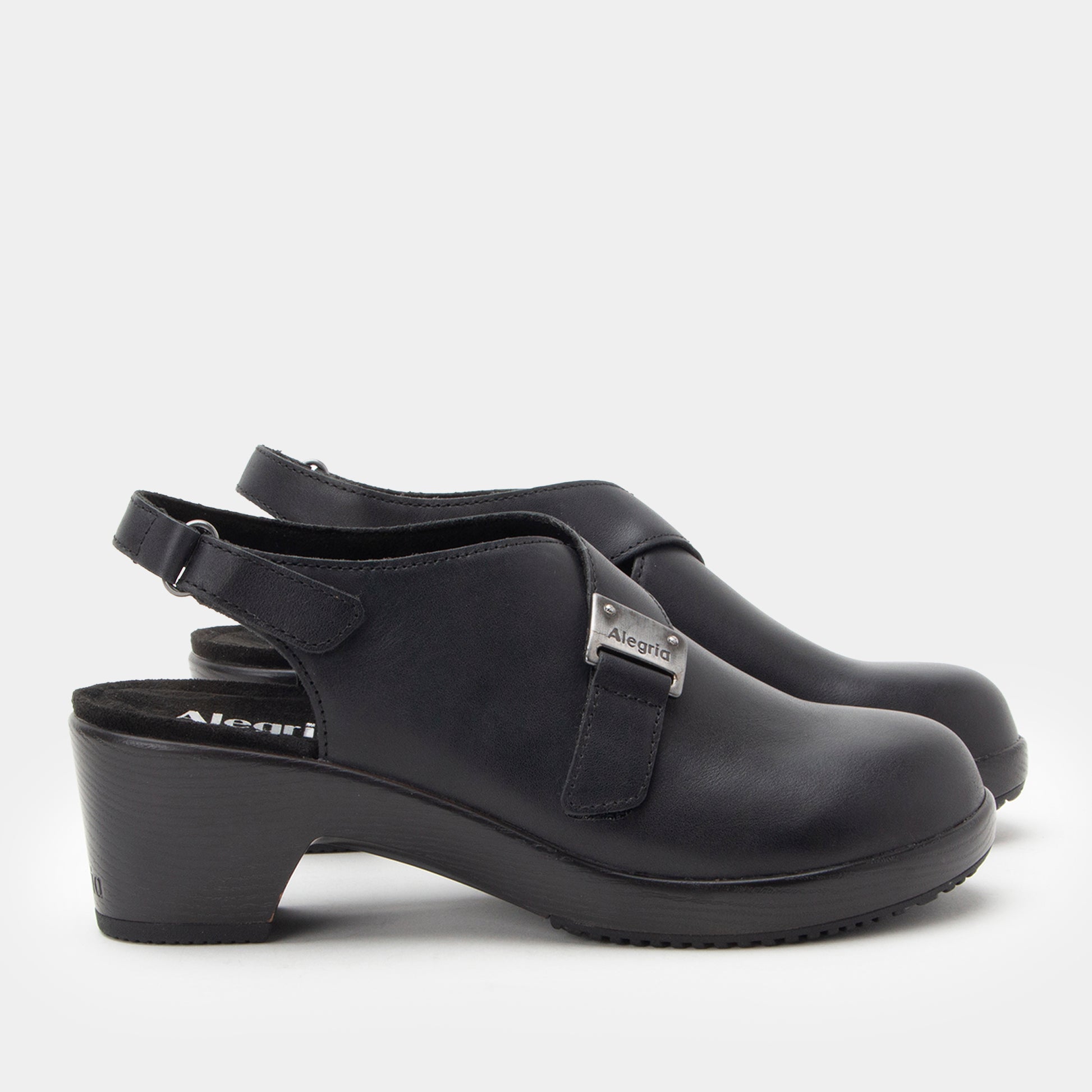 Black clogs with strap on a white background