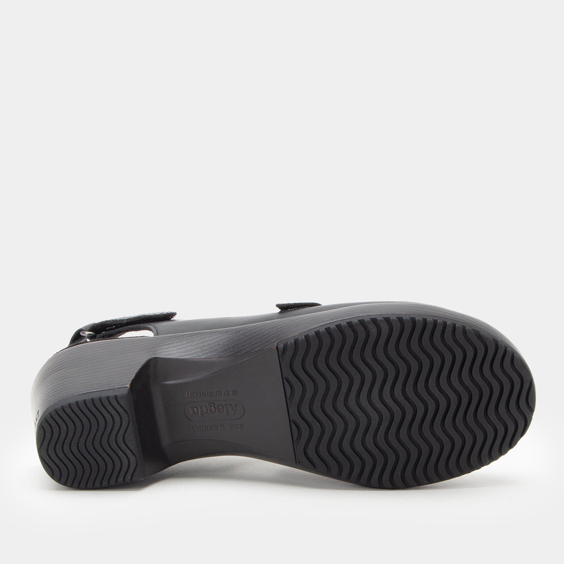 Black sandal with a textured sole on a white background