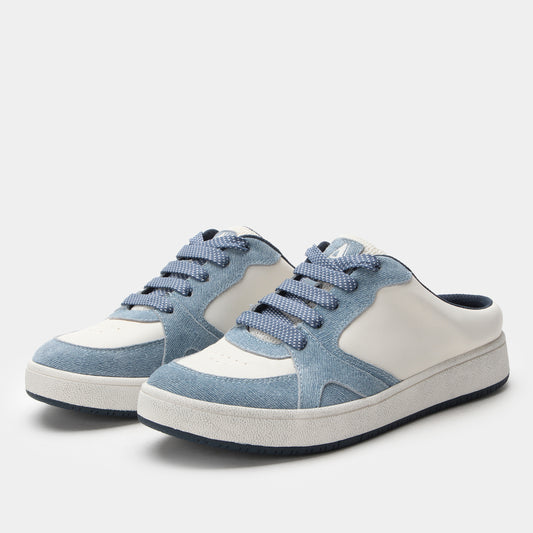 Pair of blue and white sneakers on a light gray background