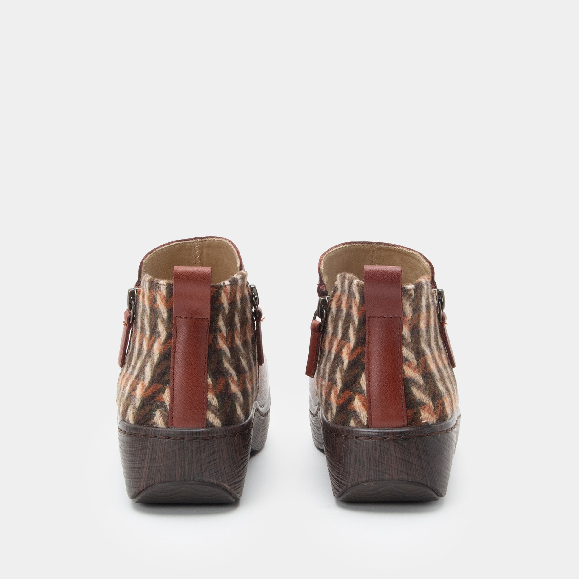 Pair of brown and beige patterned shoes on a white background