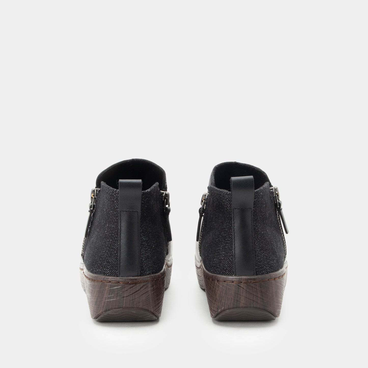 Black wedge shoes on a white background