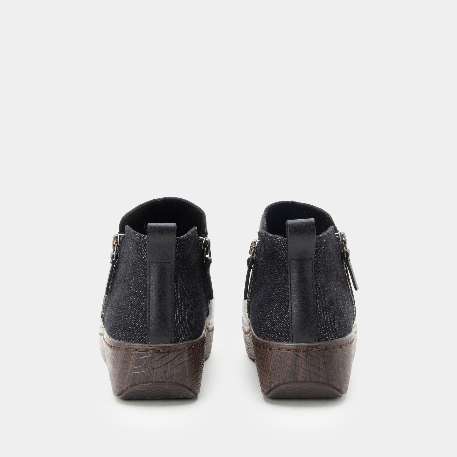 Black wedge shoes on a white background