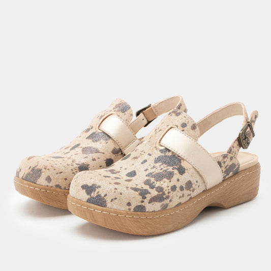A pair of women's clogs with beige and gray spotted faux-leather uppers, cream straps, and light brown platform soles, shown against a light gray background.