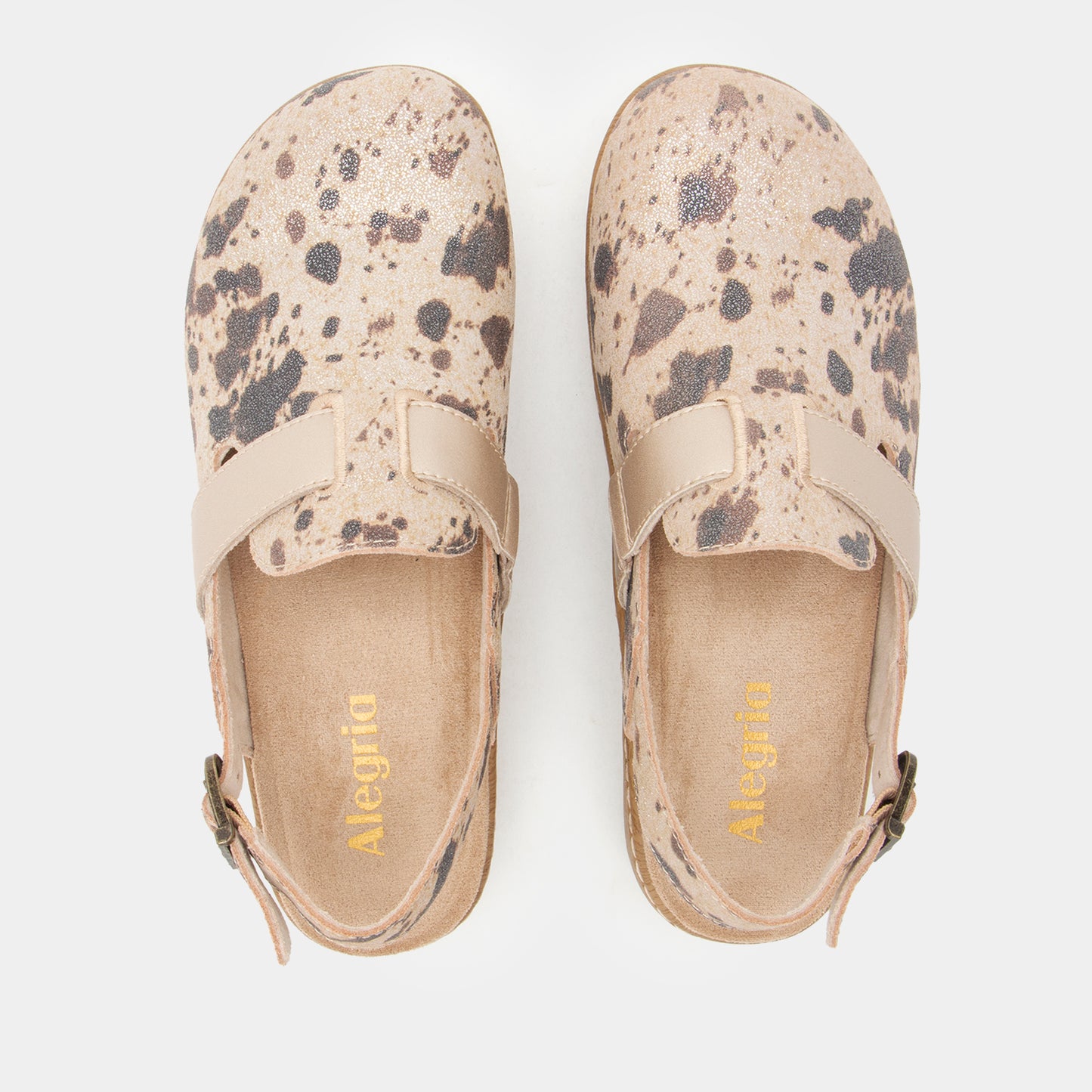 A pair of Alegría slip-on clogs with a beige and gray speckled pattern, shown from a top-down view on a light gray background.