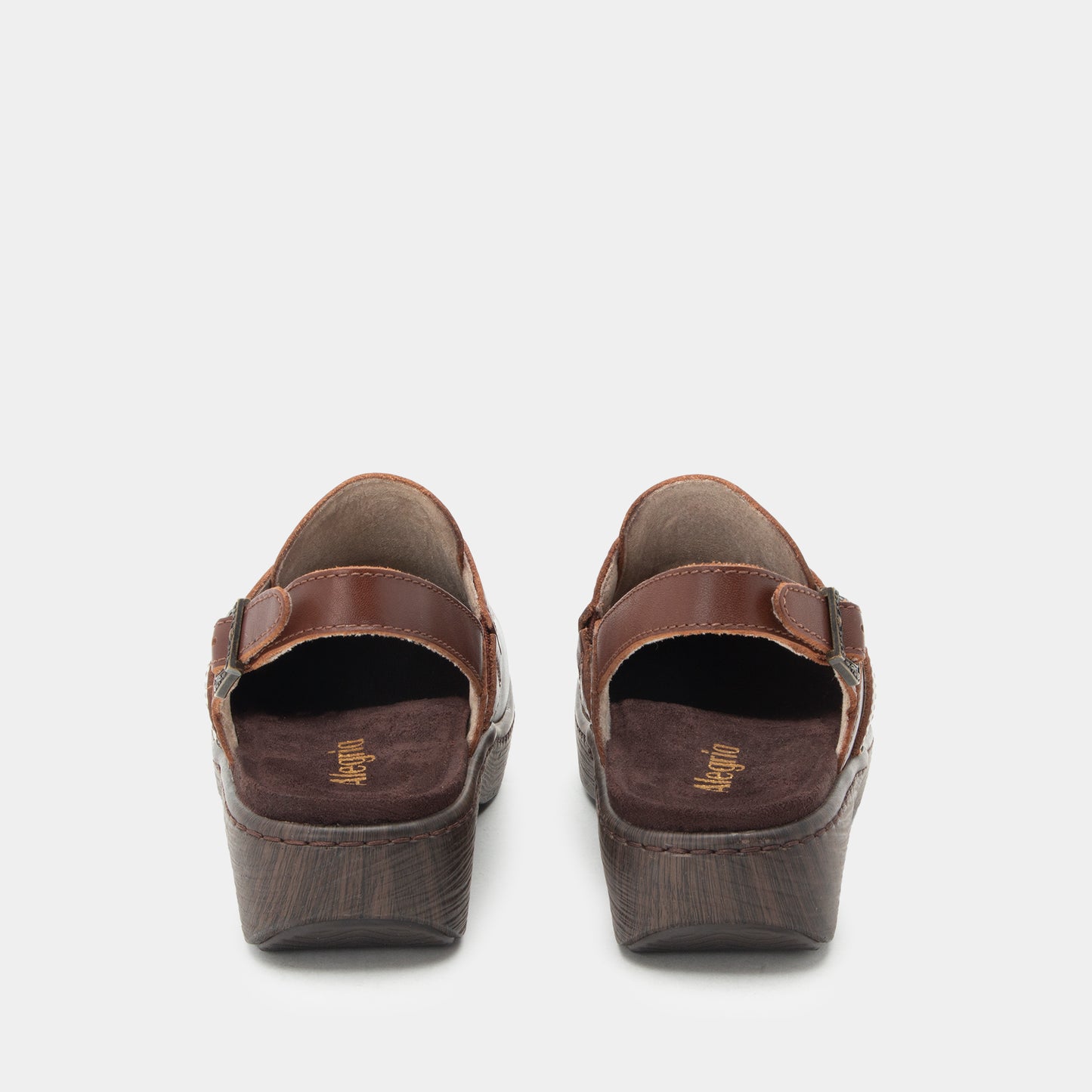 A pair of women's wedge sandals shown from the back, featuring dark brown leather straps and textured dark brown wedge heels, set against a light gray background.