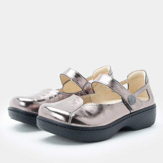 Pair of metallic silver shoes with black soles on a white background