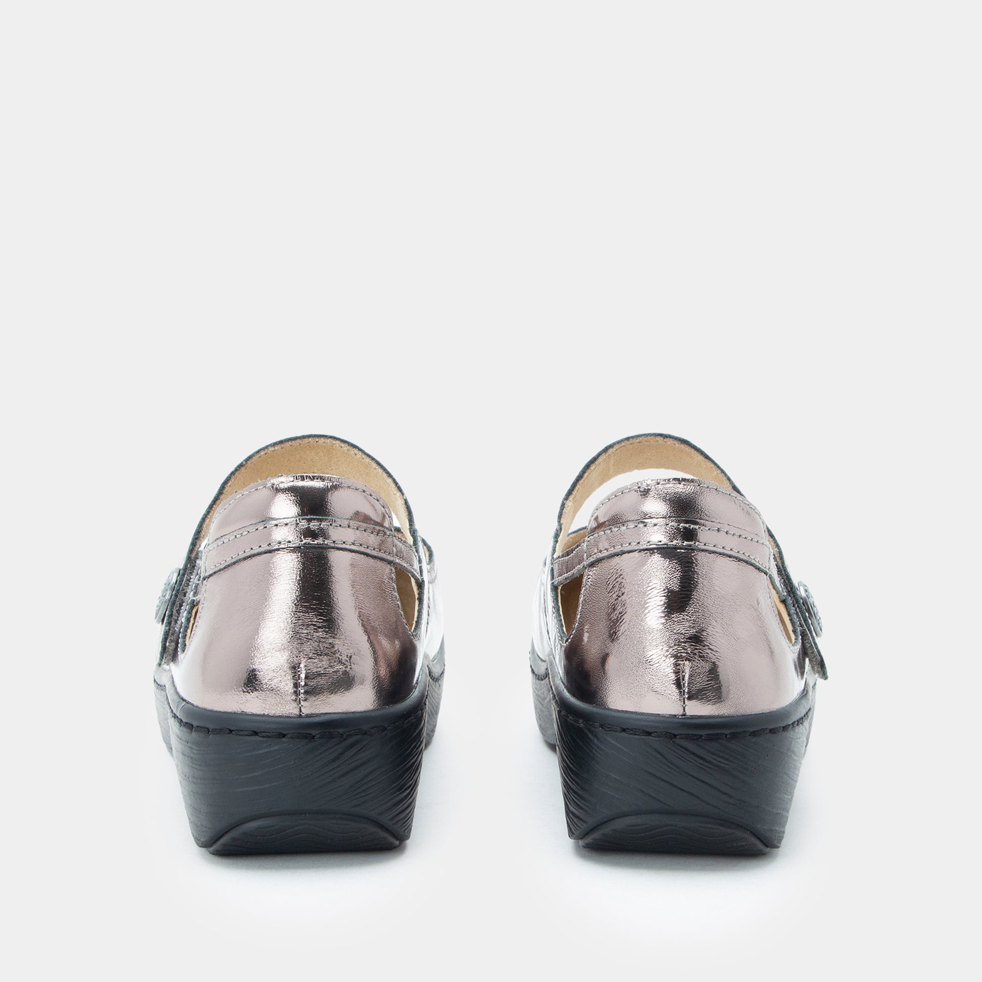 Pair of silver metallic loafers on a white background